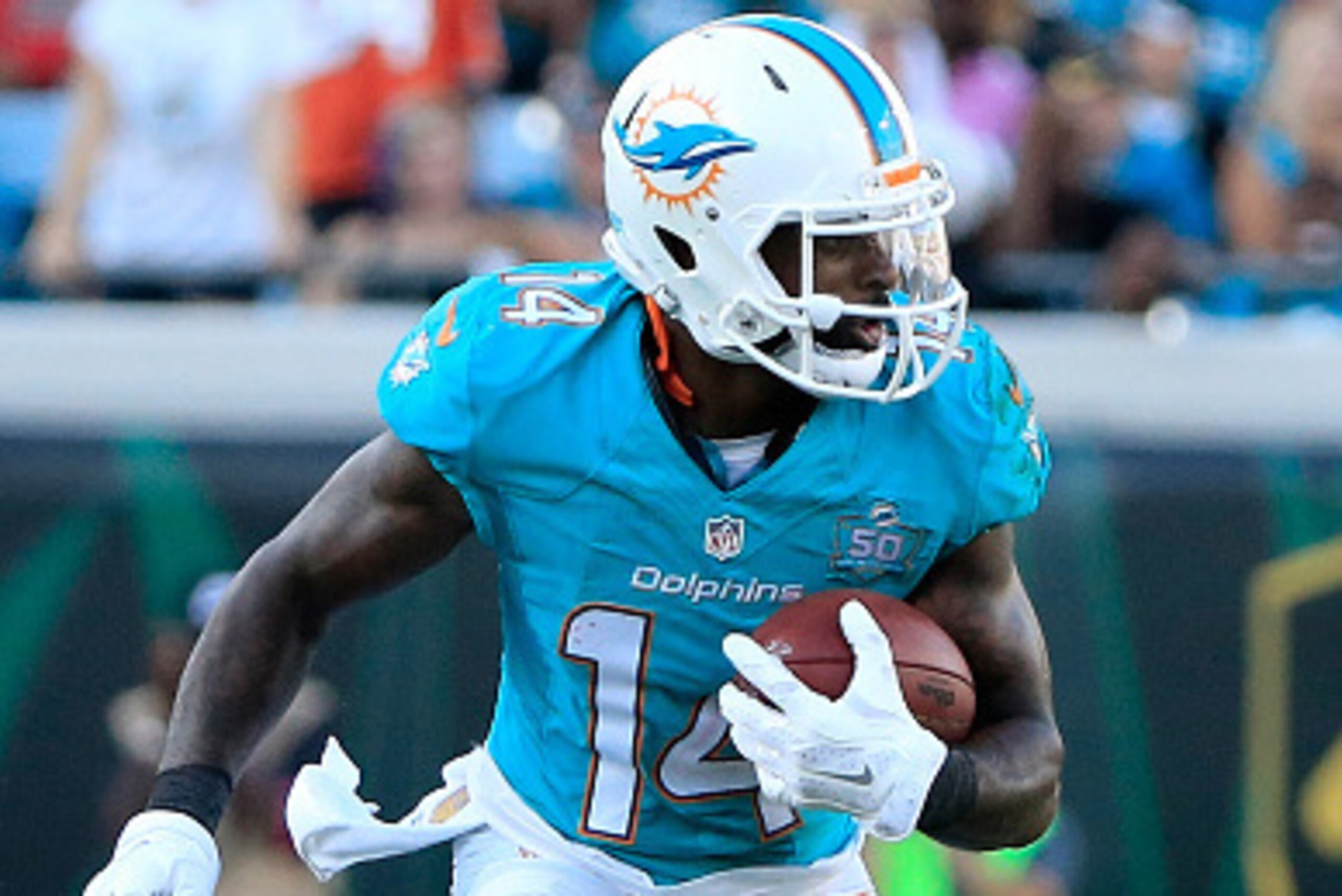 JACKSONVILLE, FL - SEPTEMBER 20:  Jarvis Landry #14 of the Miami Dolphins runs for yardage during the game against the Jacksonville Jaguars at EverBank Field on September 20, 2015 in Jacksonville, Florida.  (Photo by Sam Greenwood/Getty Images)