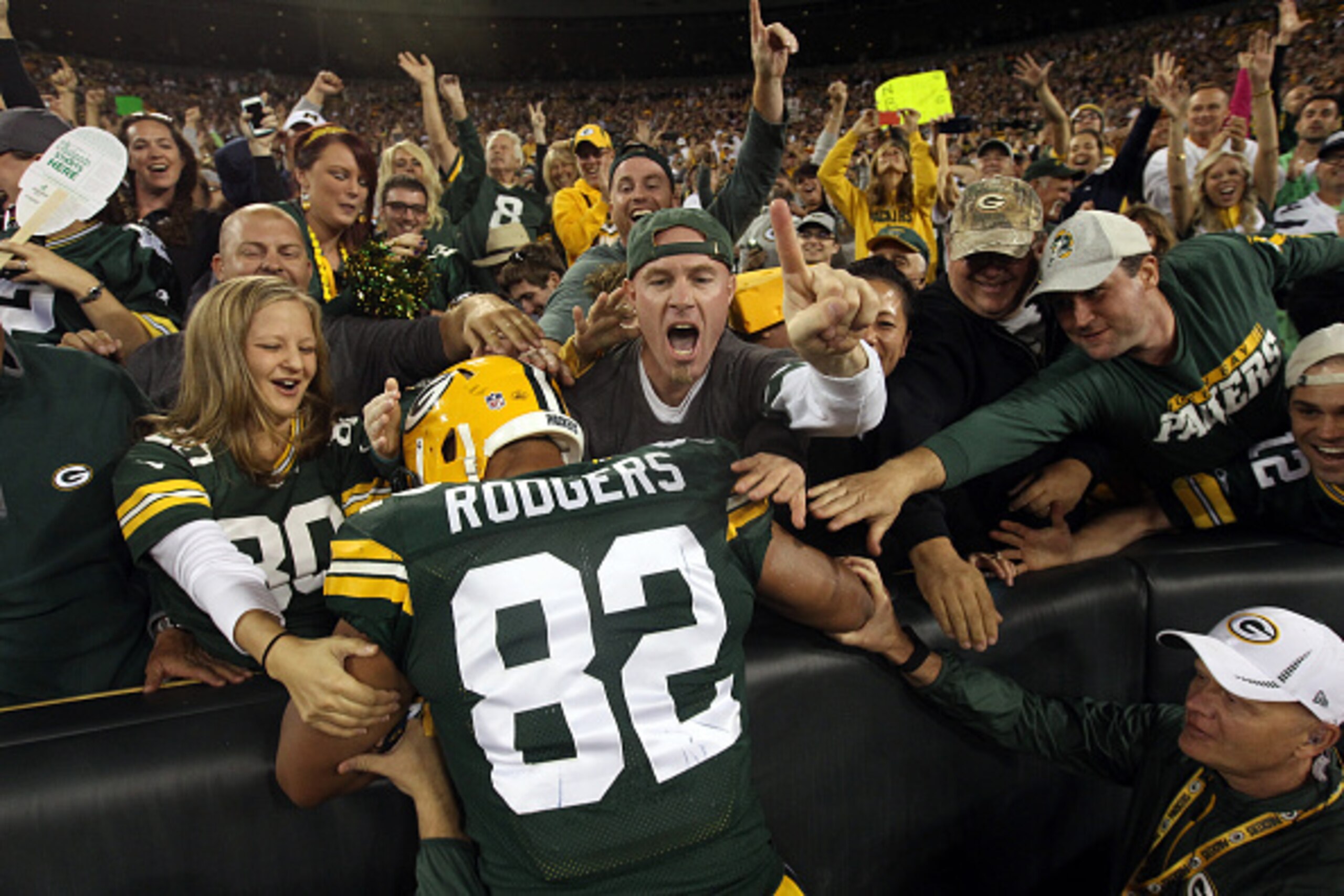 GREEN BAY, WI - SEPTEMBER 20:  Richard Rodgers #82 of the Green Bay Packers celebrates with fans after scoring a touchdown in the fourth quarter against the Seattle Seahawks during their game at Lambeau Field on September 20, 2015 in Green Bay, Wisconsin.
