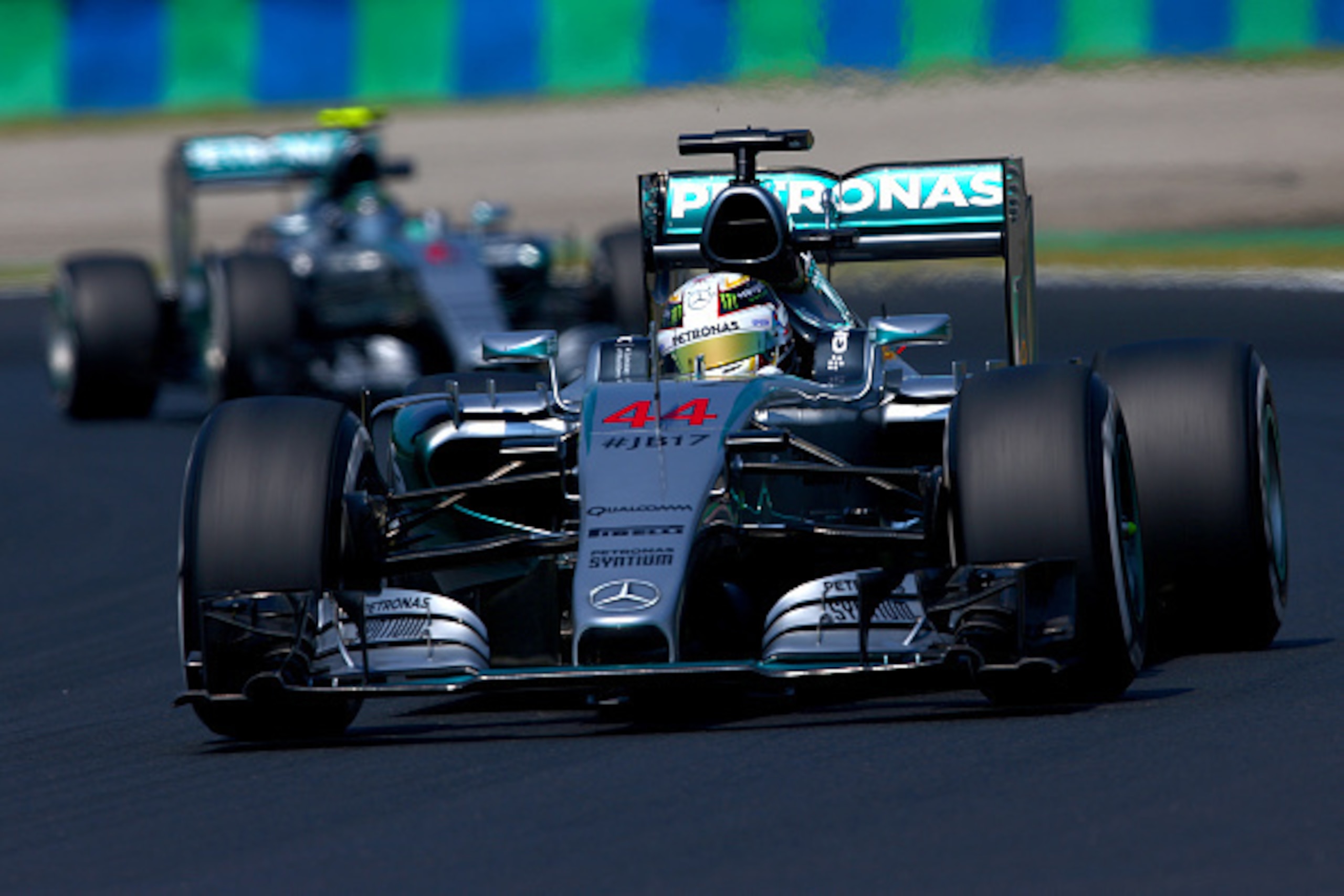 BUDAPEST, HUNGARY - JULY 24:  Lewis Hamilton of Great Britain and Mercedes GP drives ahead of Nico Rosberg of Germany and Mercedes GP during practice for the Formula One Grand Prix of Hungary at Hungaroring on July 24, 2015 in Budapest, Hungary.  (Photo b