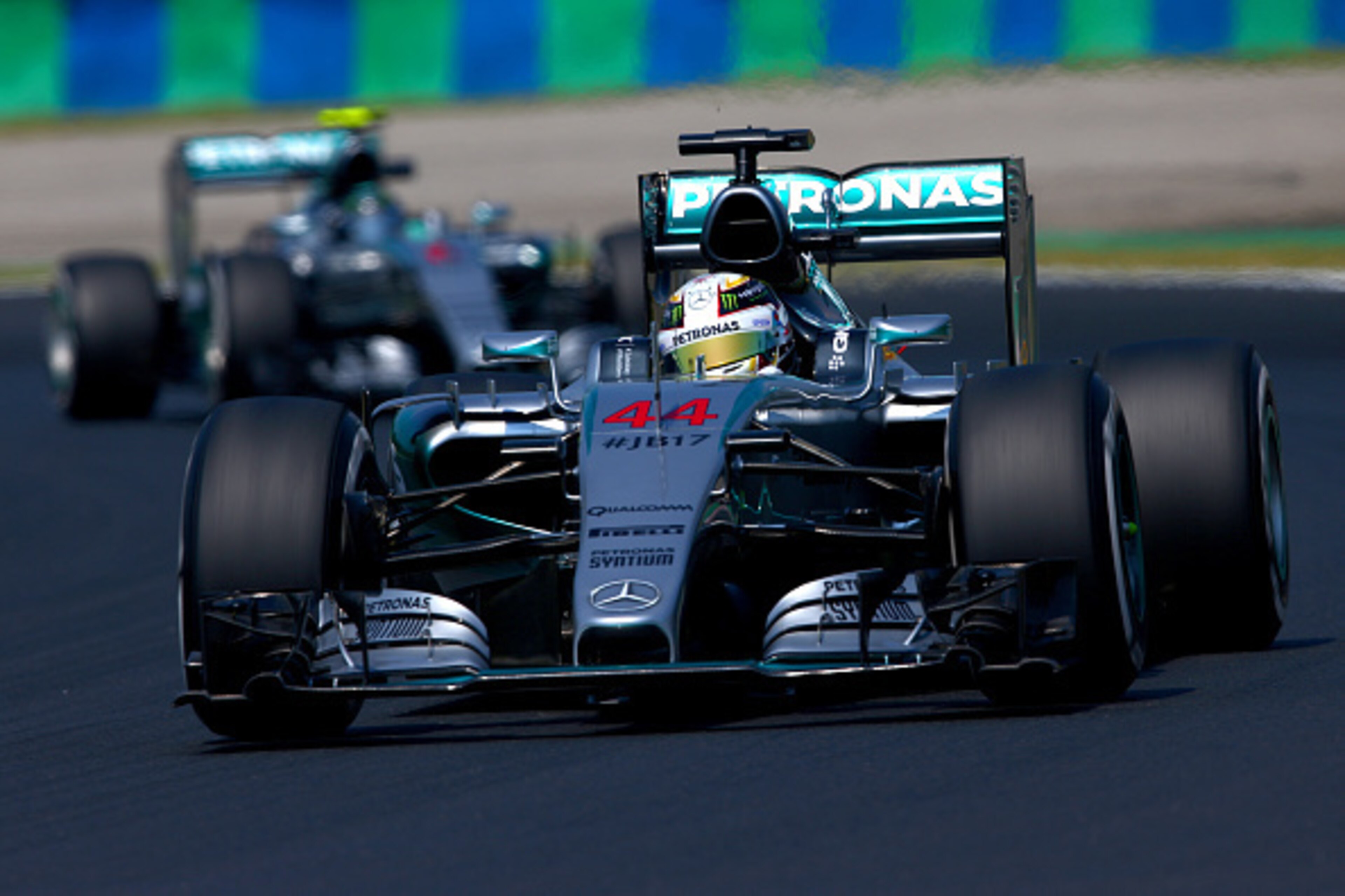 BUDAPEST, HUNGARY - JULY 24:  Lewis Hamilton of Great Britain and Mercedes GP drives ahead of Nico Rosberg of Germany and Mercedes GP during practice for the Formula One Grand Prix of Hungary at Hungaroring on July 24, 2015 in Budapest, Hungary.  (Photo b