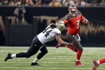 Sep 20, 2015; New Orleans, LA, USA; Tampa Bay Buccaneers quarterback Jameis Winston (3) is pursued by New Orleans Saints outside linebacker Hau'oli Kikaha (44) in the second quarter at the Mercedes-Benz Superdome. Mandatory Credit: Chuck Cook-USA TODAY Sp