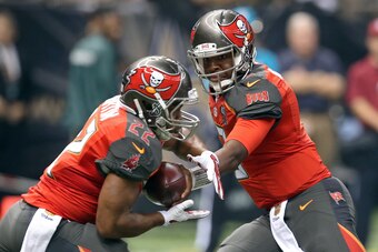 Sep 20, 2015; New Orleans, LA, USA; Tampa Bay Buccaneers quarterback Jameis Winston (3) hands off to Tampa Bay Buccaneers running back Doug Martin (22) in the first quarter of their game at the Mercedes-Benz Superdome. Mandatory Credit: Chuck Cook-USA TOD