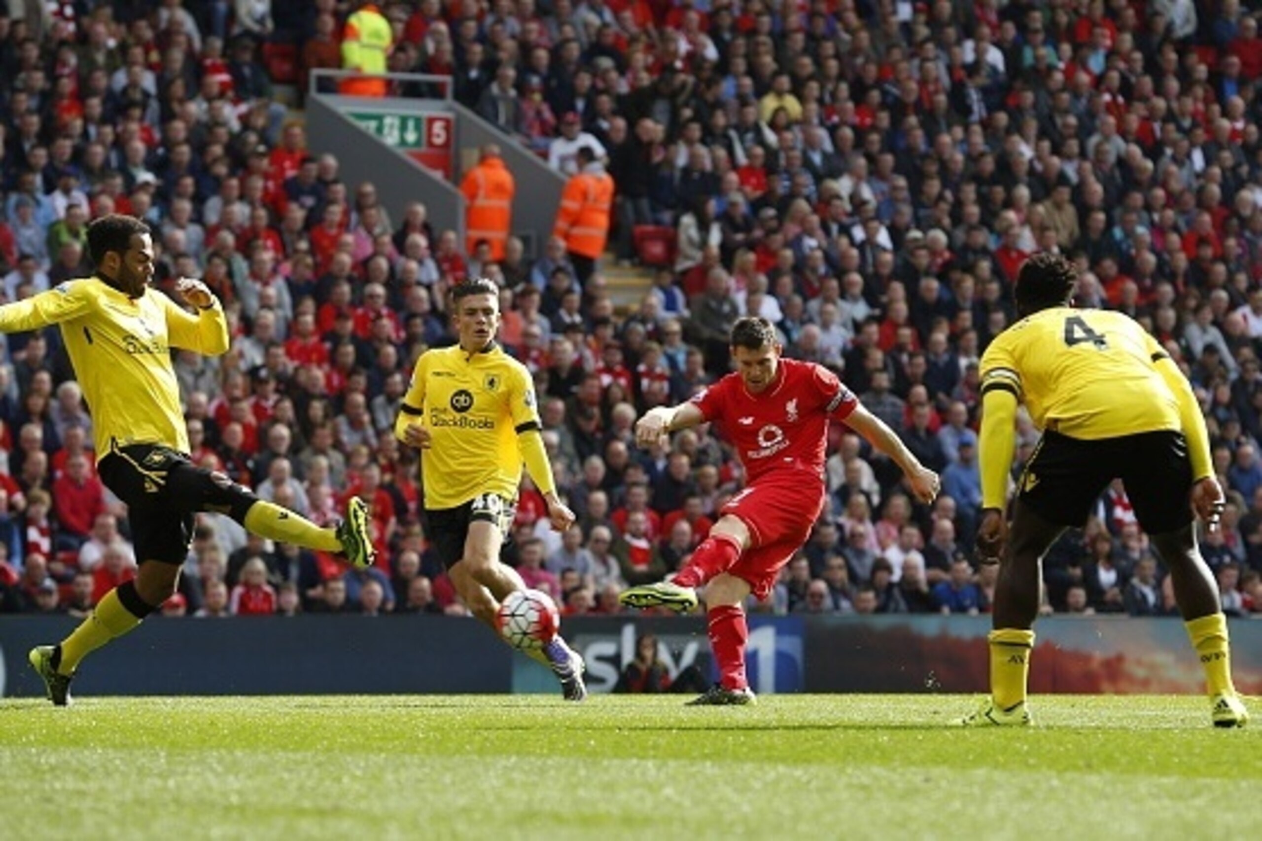 Liverpool's English midfielder James Milner (2nd R) scores his team's first goal  during the English Premier League football match between Liverpool and Aston Villa at the Anfield stadium in Liverpool, north-west England, on September 26, 2015. AFP PHOTO 