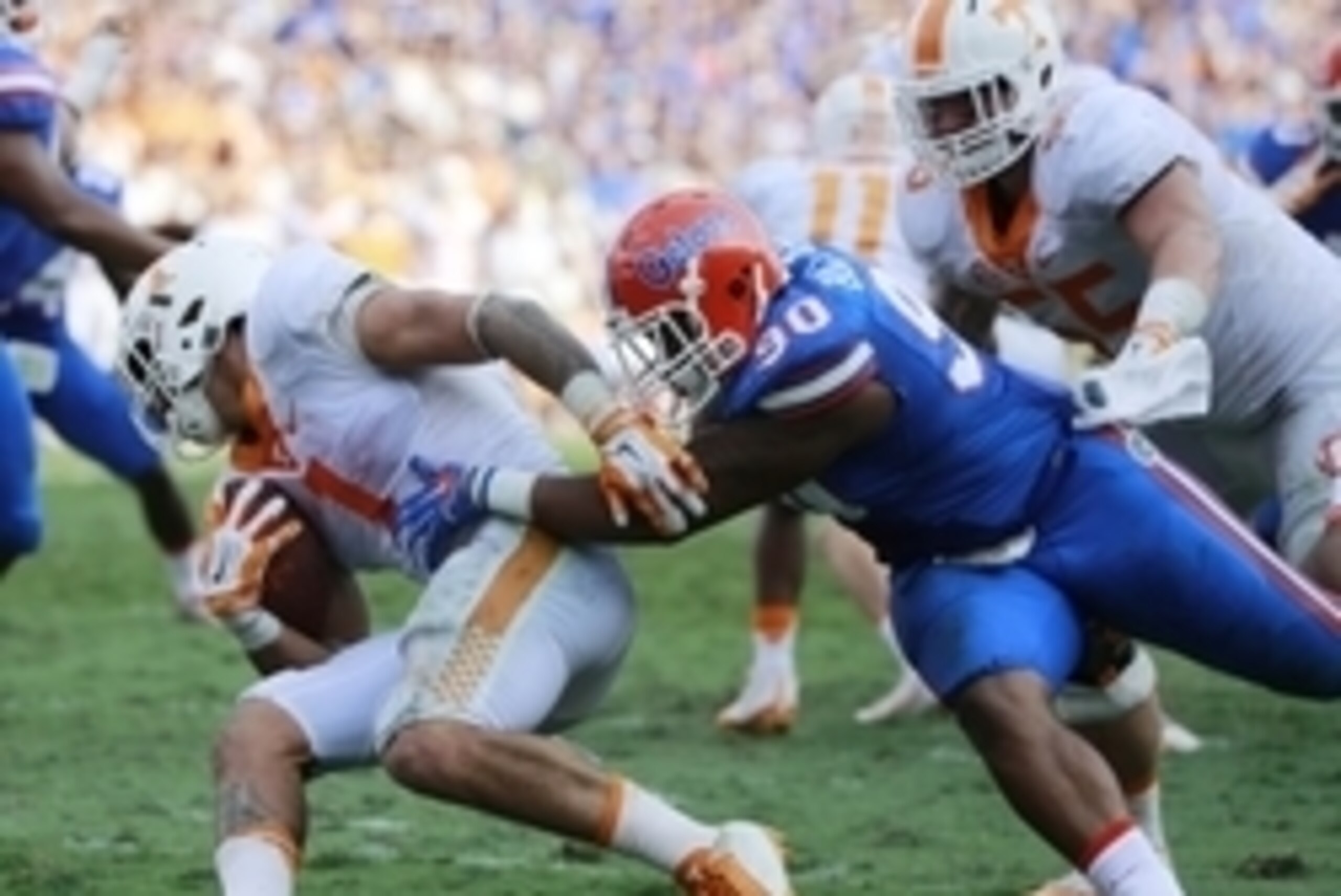 Sep 26, 2015; Gainesville, FL, USA; Florida Gators defensive lineman Jonathan Bullard (90) tackles Tennessee Volunteers running back Jalen Hurd (1) during the first half at Ben Hill Griffin Stadium. Mandatory Credit: Kim Klement-USA TODAY Sports
