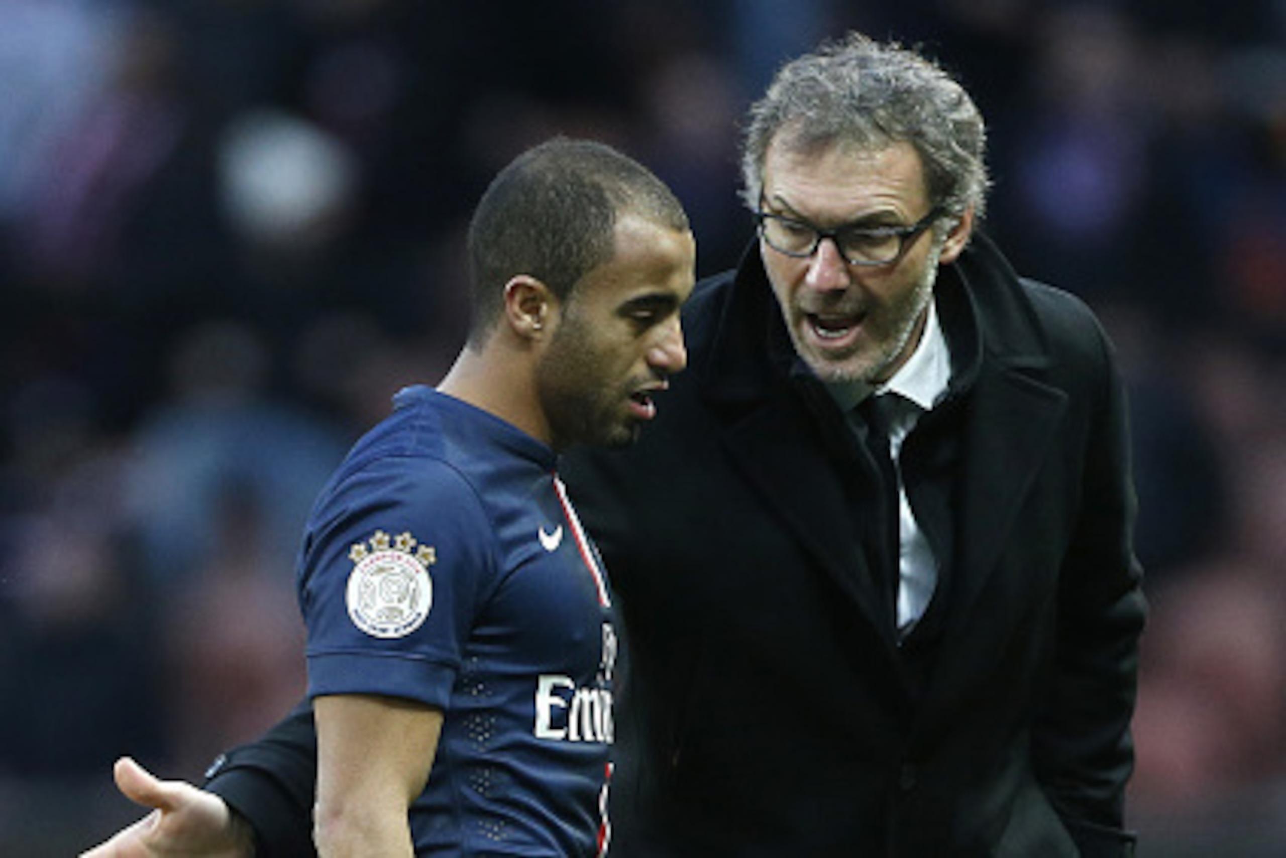 PARIS, FRANCE - FEBRUARY 14: Head coach of PSG Laurent Blanc cheers Lucas Moura of PSG when he leaves the pitch because of an injury during the French Ligue 1 match between Paris Saint-Germain FC and Stade Malherbe Caen at Parc des Princes stadium on Febr