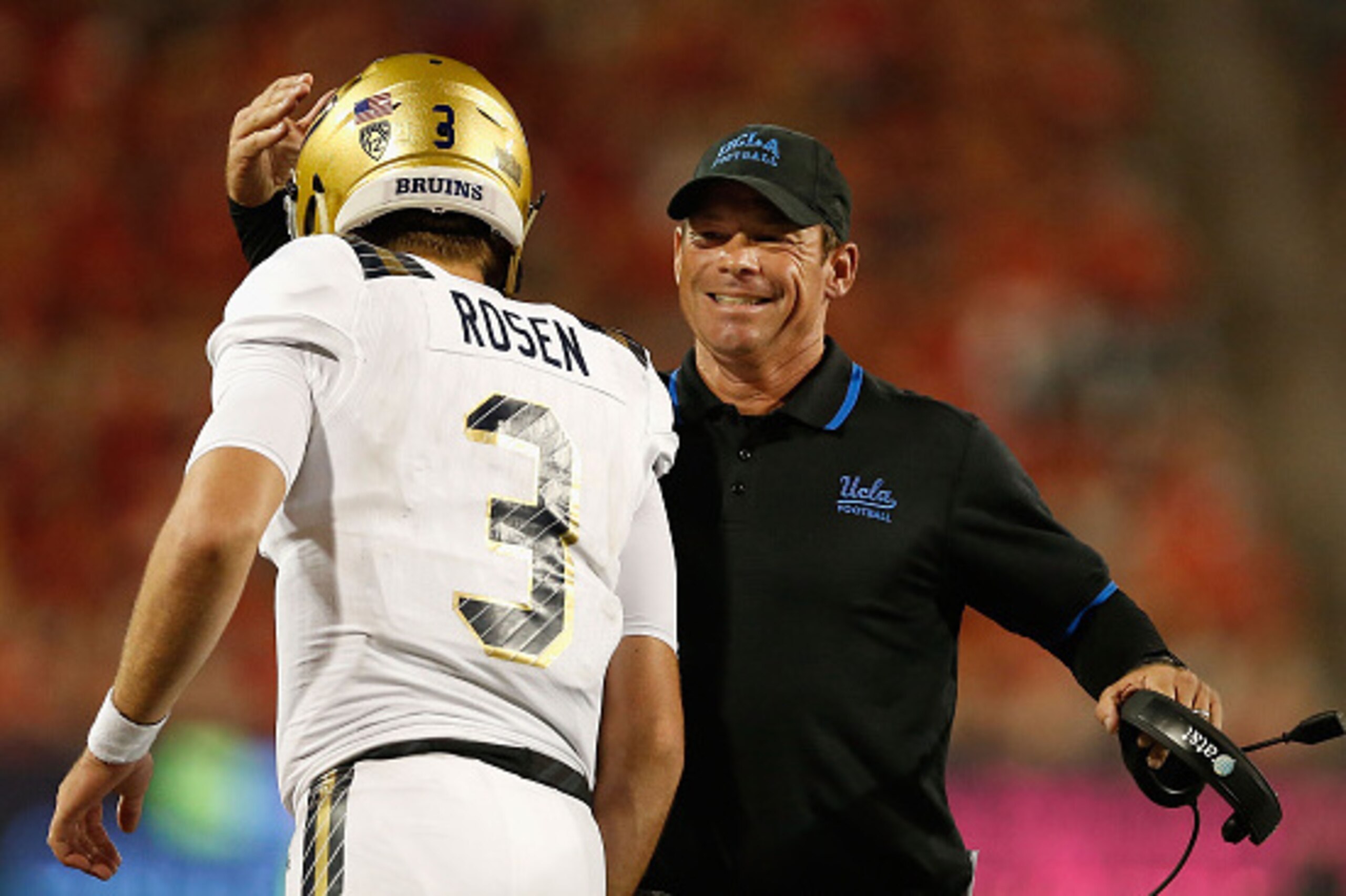 TUCSON, AZ - SEPTEMBER 26:  Head coach Jim Mora of the UCLA Bruins congratulates quarterback Josh Rosen #3 after Rosen scored on a eighth yard rushing touchdown against the Arizona Wildcats  during the thrid quarter of the college football game at Arizona