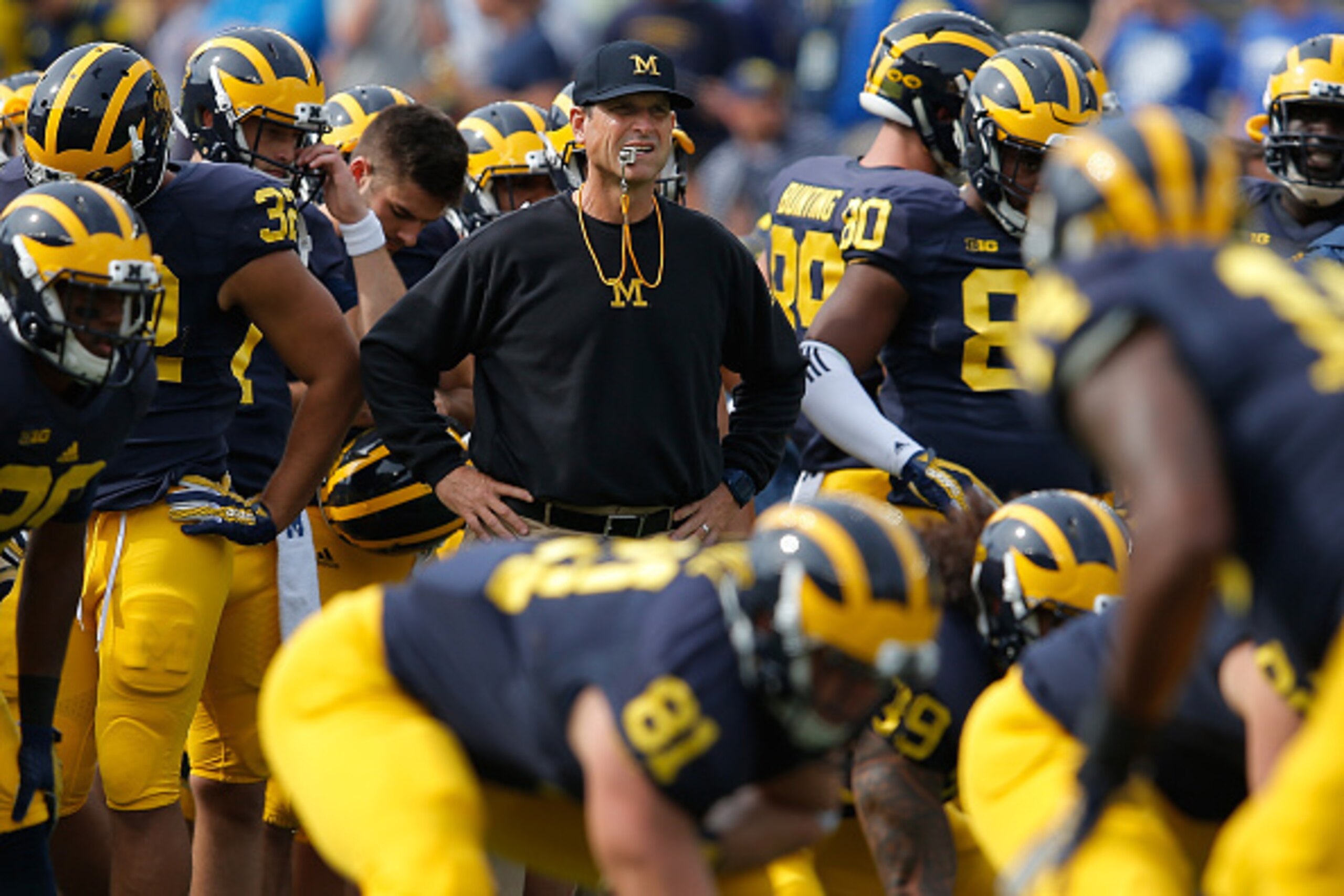 ANN ARBOR, MI - SEPTEMBER 26:  Head coach Jim Harbaugh of the Michigan Wolverines  prepares to lead his team against the Brigham Young Cougars at Michigan Stadium on September 26, 2015 in Ann Arbor, Michigan.  (Photo by Doug Pensinger/Getty Images)