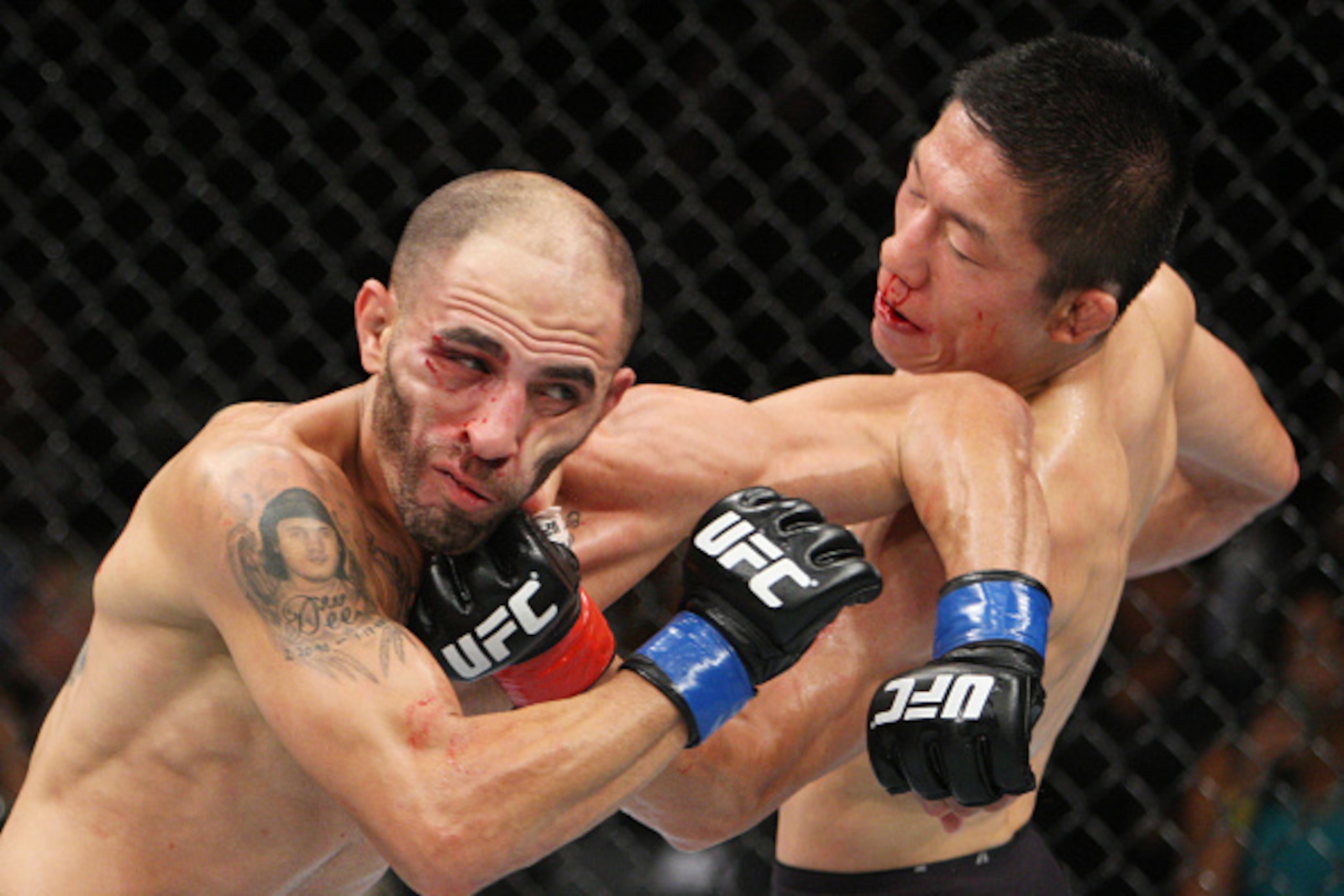 SAITAMA, JAPAN - SEPTEMBER 27: Kyoji Horiguchi of Japan punches Chico Camus of the United States of America in their flyweight bout during the UFC event at the Saitama Super Arena on September 27, 2015 in Saitama, Japan. (Photo by Mitch Viquez/Zuffa LLC/Z
