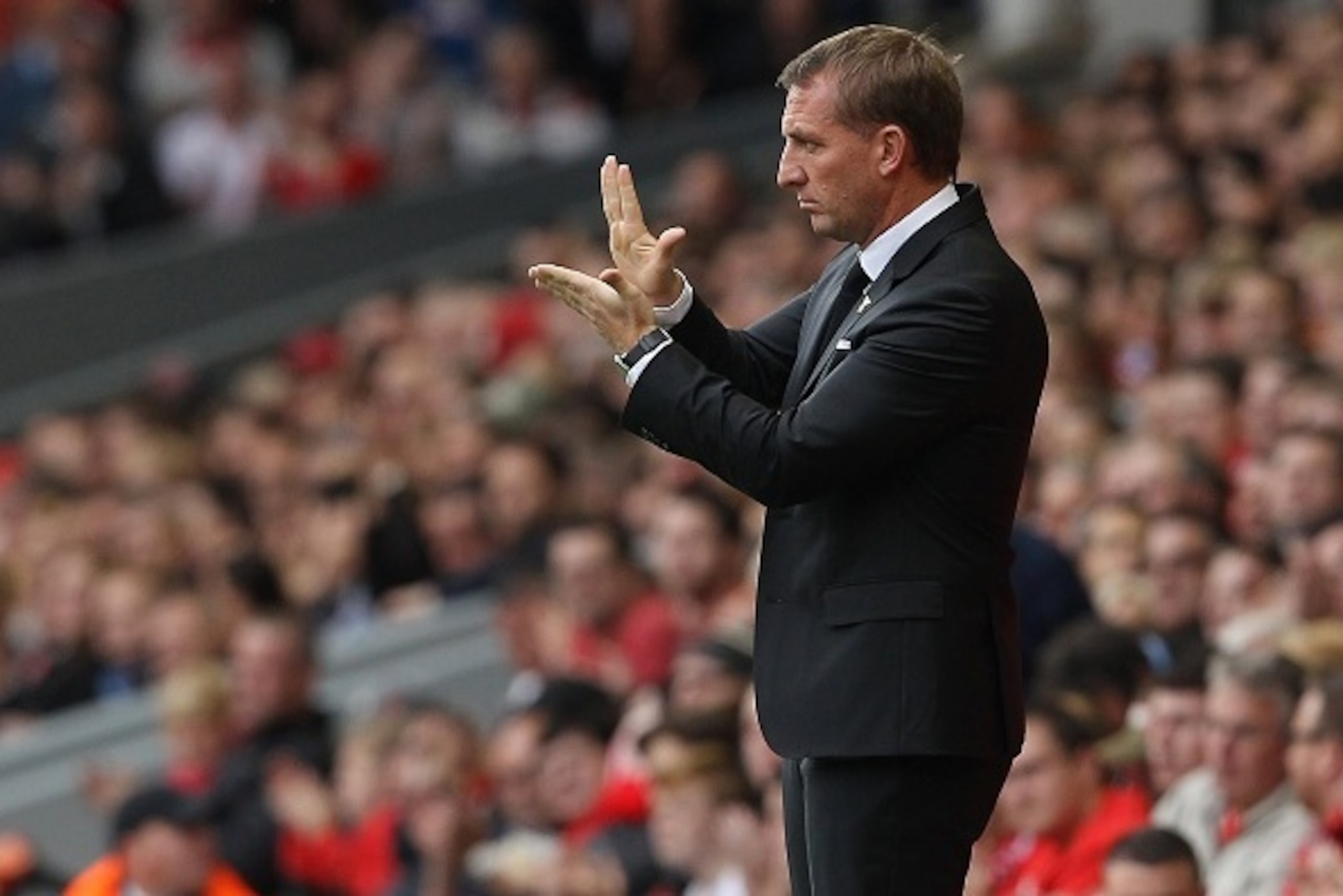 Liverpool's Northern Irish manager Brendan Rodgers instructs his team during the English Premier League football match between Liverpool and Aston Villa at the Anfield stadium in Liverpool, north-west England, on September 26, 2015. AFP PHOTO / LINDSEY PA