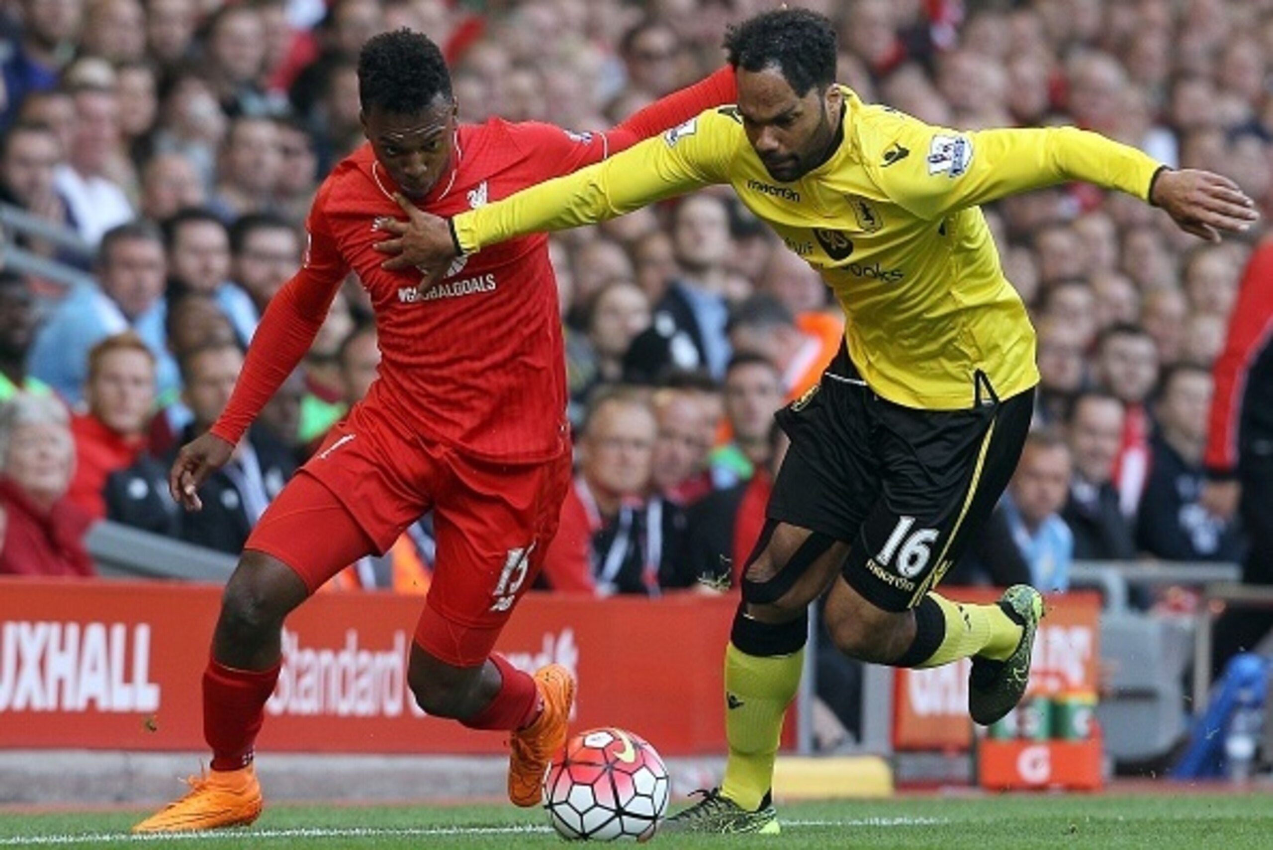 Aston Villa's English defender Joleon Lescott (R) vies for the ball with Liverpool's English striker Daniel Sturridge  during the English Premier League football match between Liverpool and Aston Villa at the Anfield stadium in Liverpool, north-west Engla