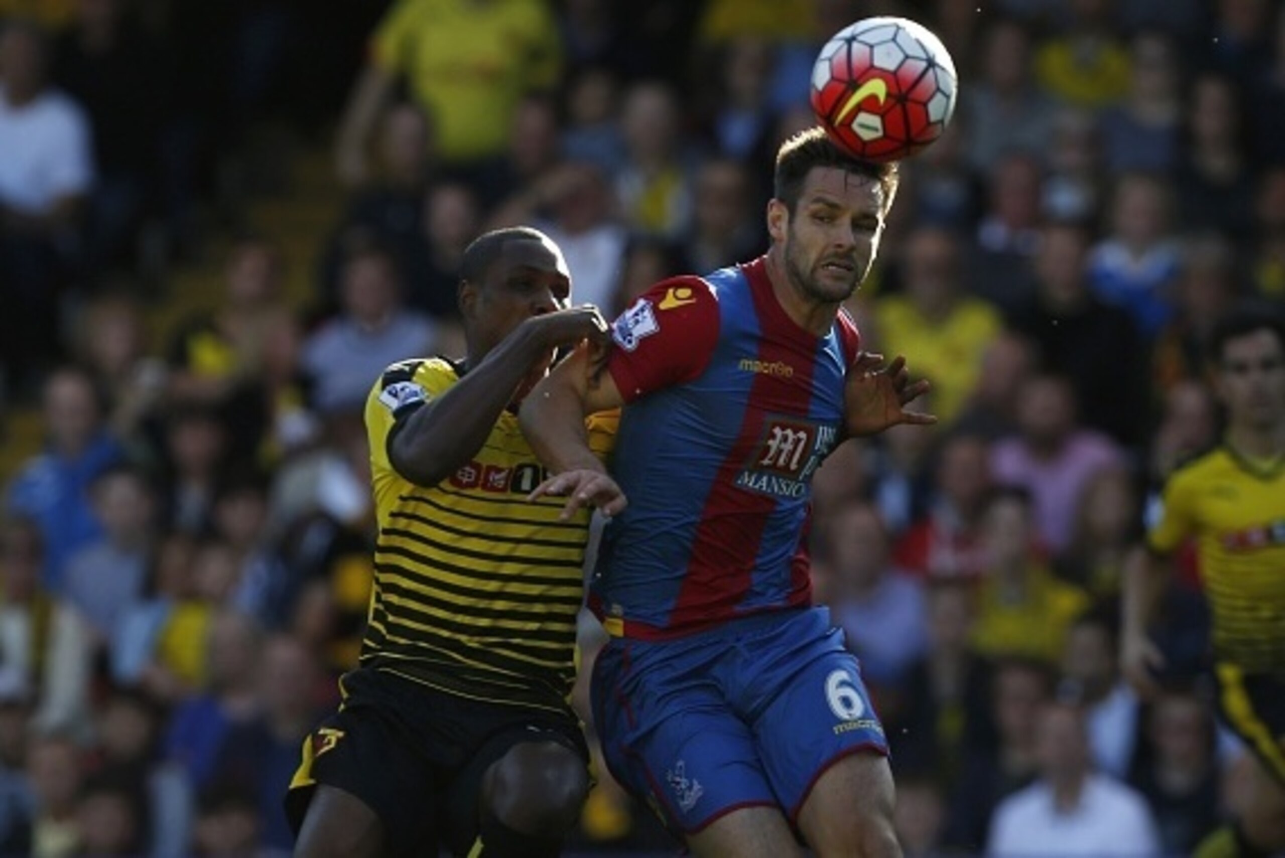 Watford's Nigerian striker Odion Ighalo (L) vies with Crystal Palace's English defender Scott Dann (R) during the English Premier League football match between Watford and Crystal Palace at Vicarage Road Stadium in Watford, north of London on September 27