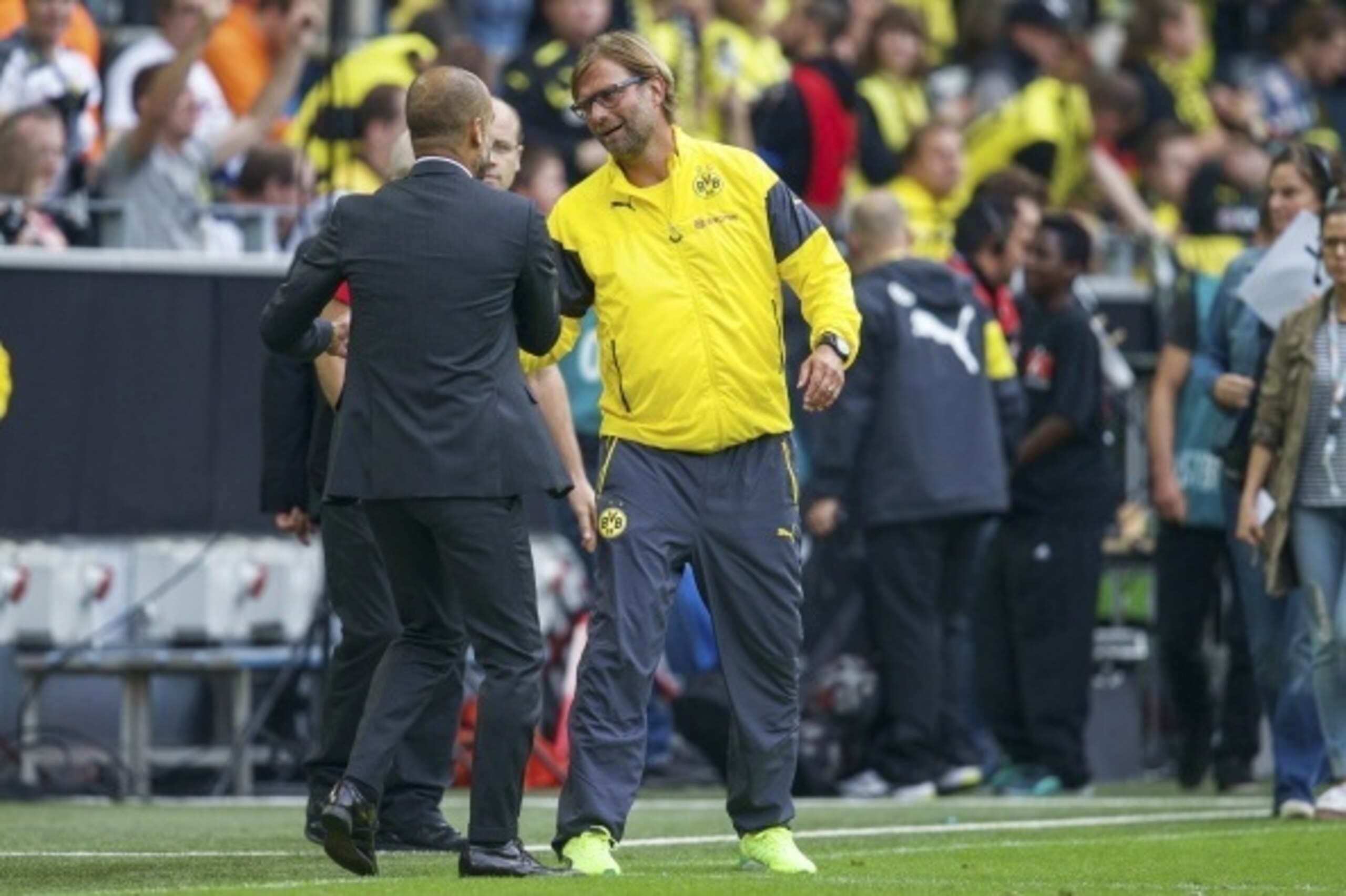 (L-R) coach Pep Guardiola of Bayern Munich, coach Jurgen Klopp of Borussia Dortmund during the DFL Supercup 2014 match between Bayern Munich on August 13, 2014 at the Signal Iduna Park stadium in Dortmund, Germany.(Photo by VI Images via Getty Images)