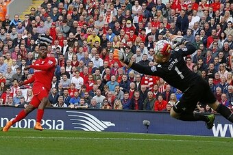 Liverpool's English striker Daniel Sturridge (L) scores his team's second goal during the English Premier League football match between Liverpool and Aston Villa at the Anfield stadium in Liverpool, north-west England, on September 26, 2015. AFP PHOTO / L