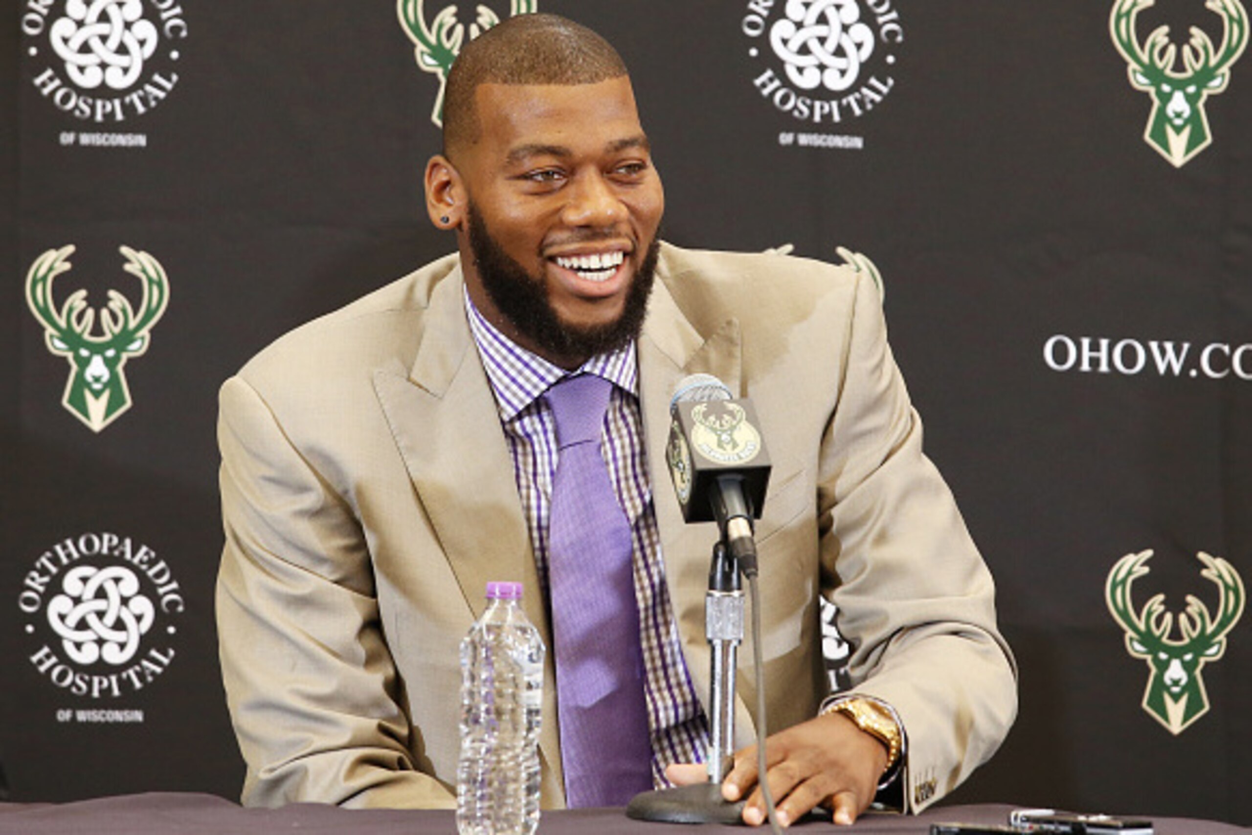 ST. FRANCIS, WI - JULY 9: Recently signed free agents Greg Monroe and Khris Middleton of the Milwaukee Bucks are joined by general manager John Hammond and head coach Jason Kidd during a press conference at the Orthopaedic Hospital of Wisconsin Training C