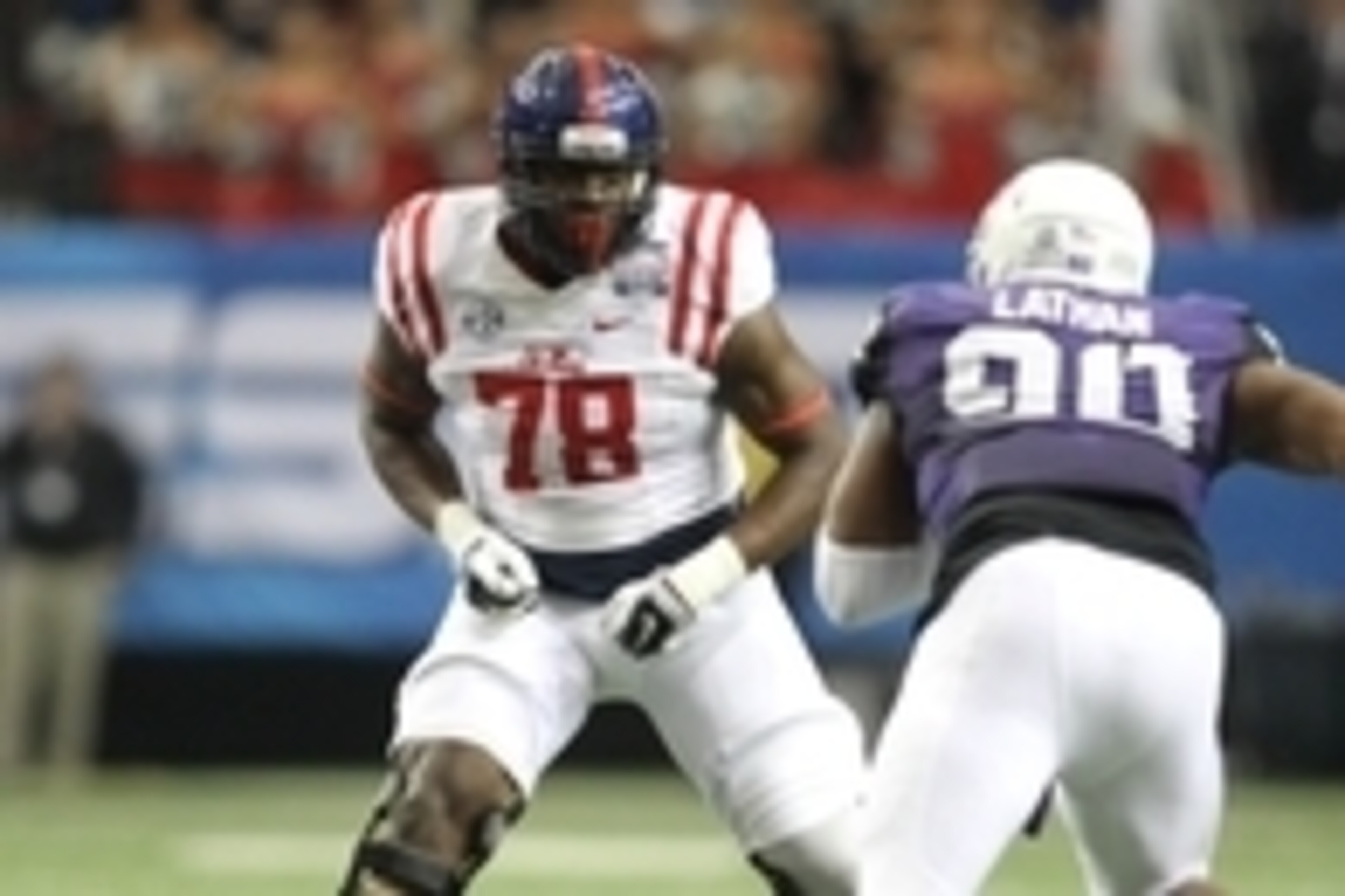 Dec 31, 2014; Atlanta , GA, USA; Mississippi Rebels offensive lineman Laremy Tunsil (78) prepares to block TCU Horned Frogs defensive tackle Terrell Lathan (90) during the first quarter in the 2014 Peach Bowl at the Georgia Dome. Mandatory Credit: Brett D