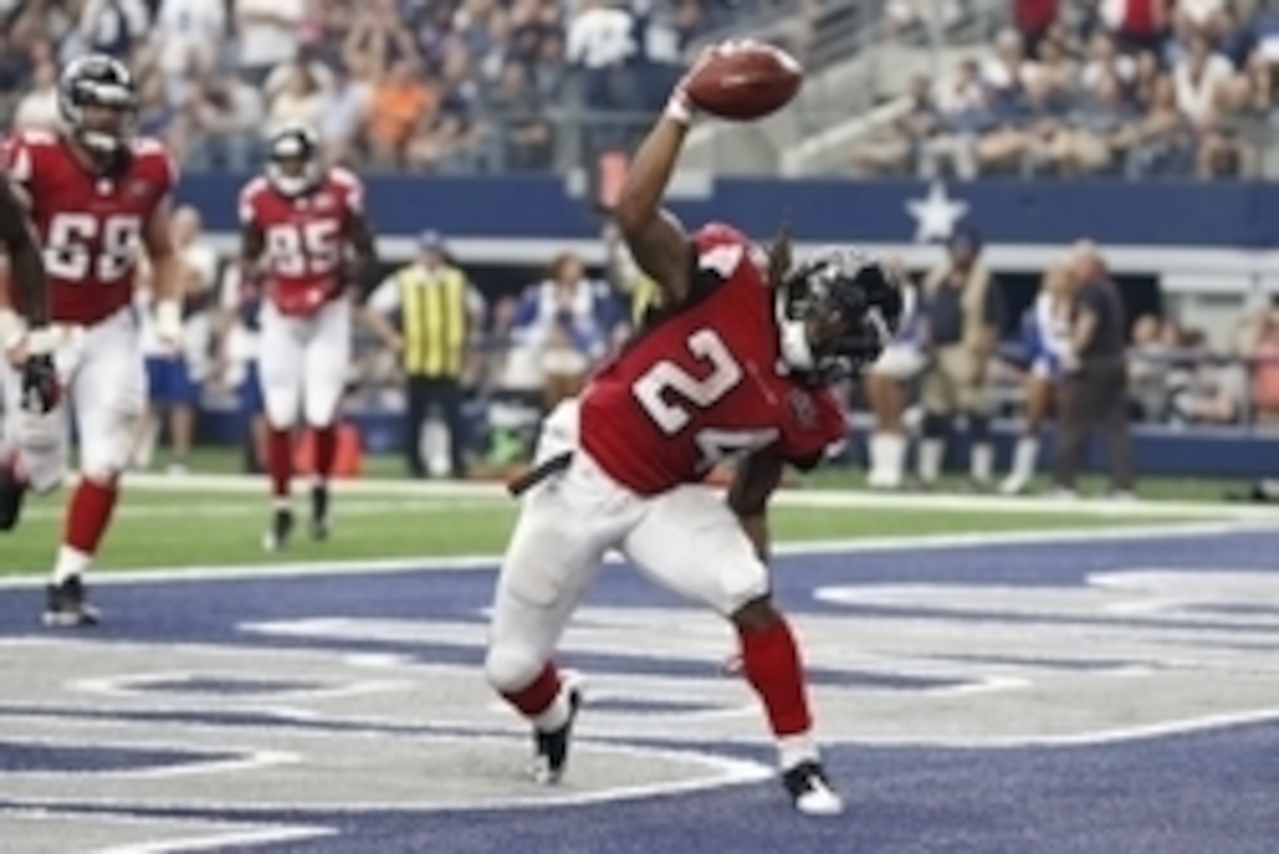 Sep 27, 2015; Arlington, TX, USA; Atlanta Falcons running back Devonta Freeman (24) spikes the ball after scoring a fourth quarter touchdown against the Dallas Cowboys at AT&T Stadium. Mandatory Credit: Matthew Emmons-USA TODAY Sports