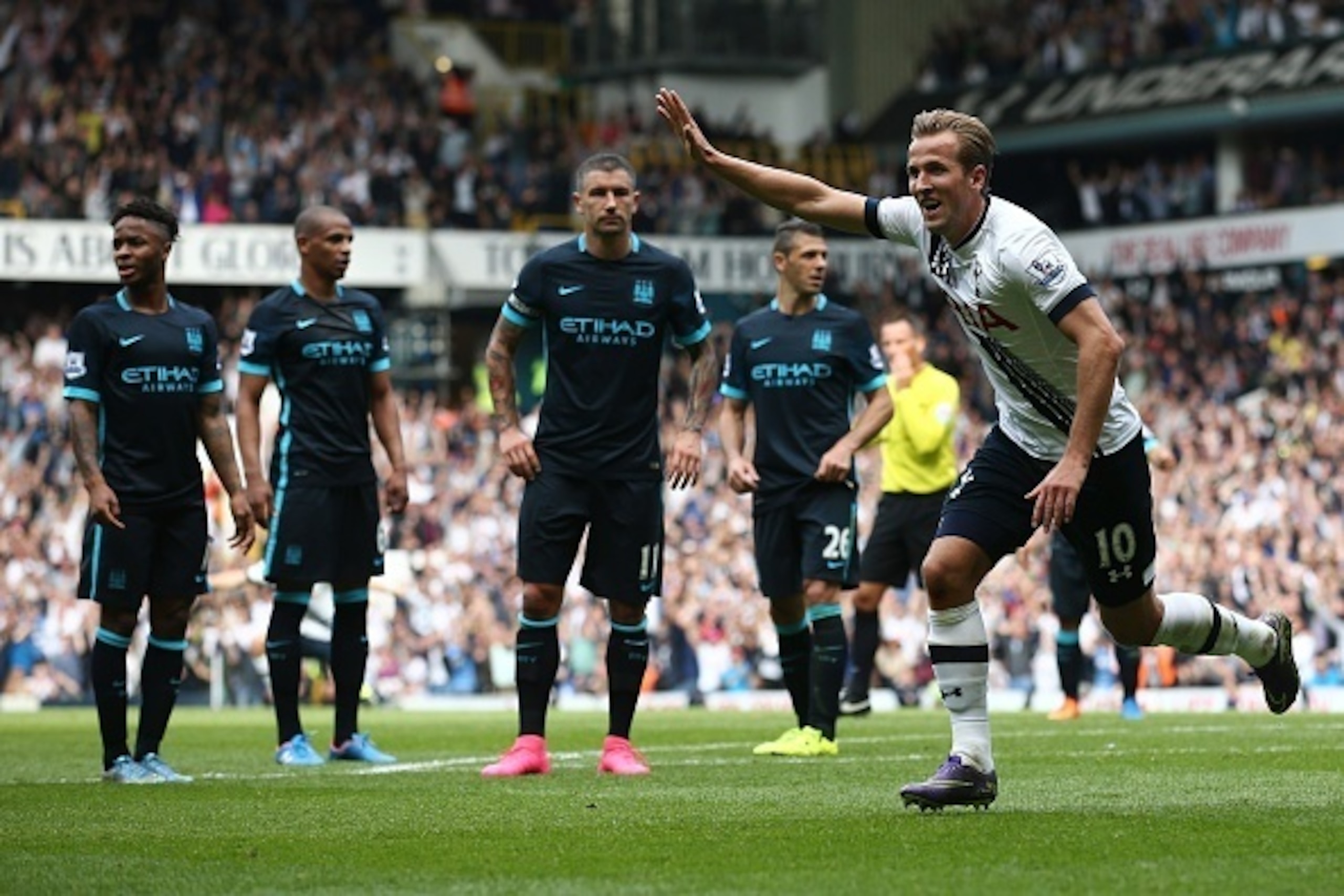 Tottenham Hotspur's English striker Harry Kane celebrates after scoring their third goal during the English Premier League football match between Tottenham Hotspur and Manchester City at White Hart Lane in north London on September 26, 2015. AFP PHOTO / J