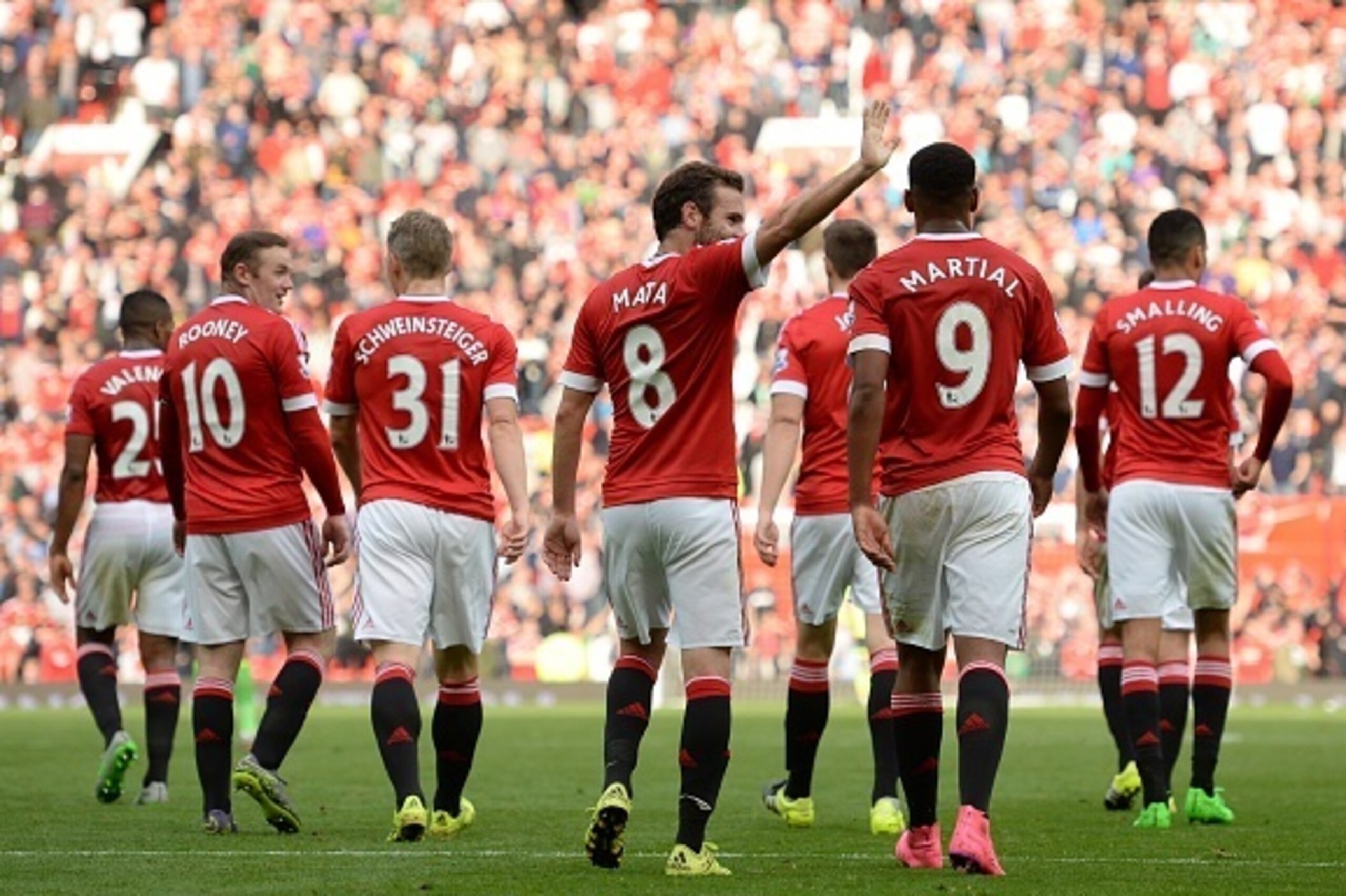 Manchester United's Spanish midfielder Juan Mata (C) gestures as players walk back to the half way line, after scoring their third goal during the English Premier League football match between Manchester United and Sunderland at Old Trafford in Manchester Manchester United's Spanish midfielder Juan Mata (C) gestures as players walk back to the half way line, after scoring their third goal during the English Premier League football match between Manchester United and Sunderland at Old Trafford in Manchester