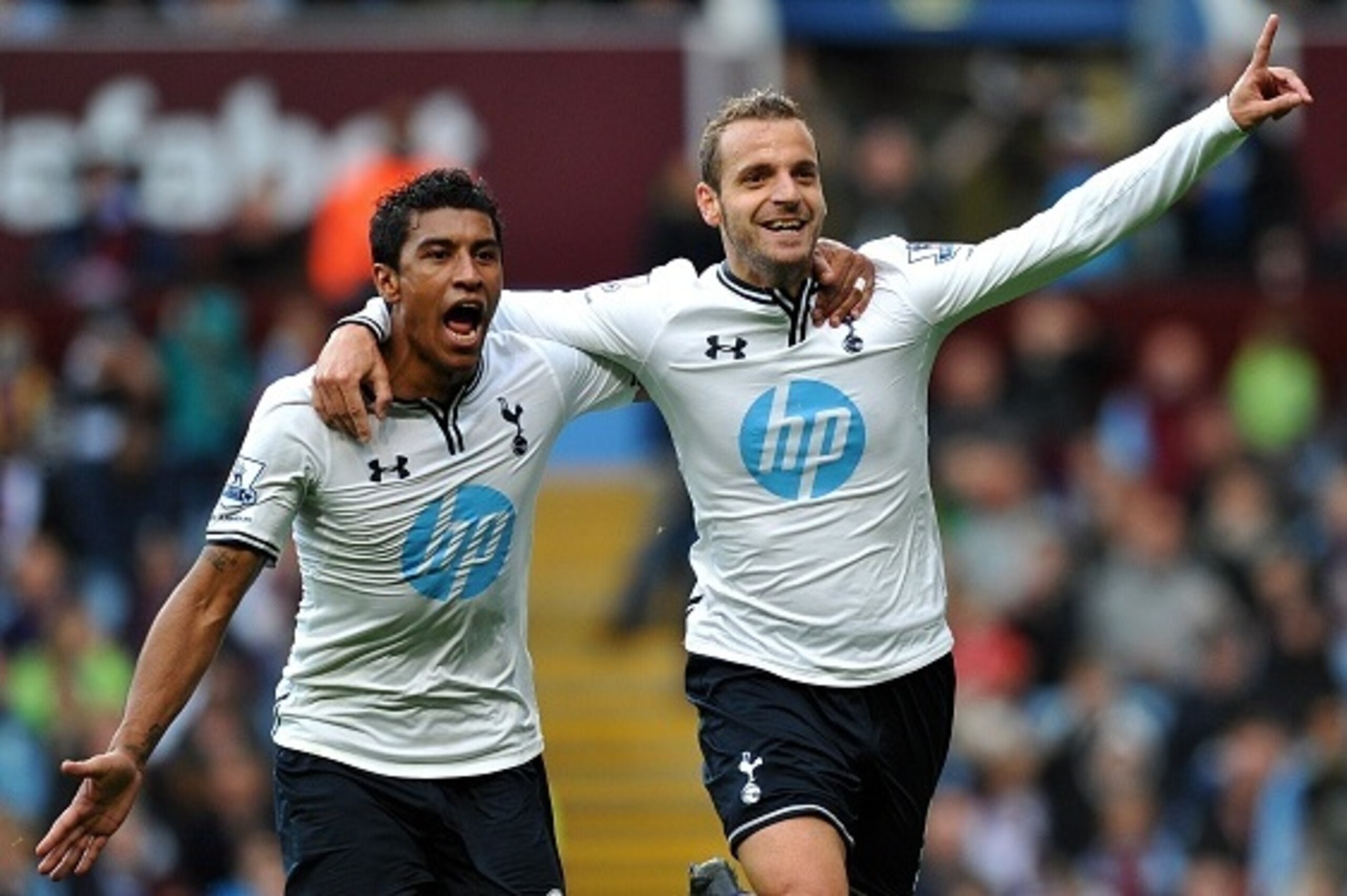 Tottenham Hotspur's Spanish striker  Roberto Soldado (R) celebrates after he scored his team's second goal with Brazilian midfielder Paulinho during the English Premier League football match between Aston Villa and Tottenham Hotspur at Villa Park in Birmi