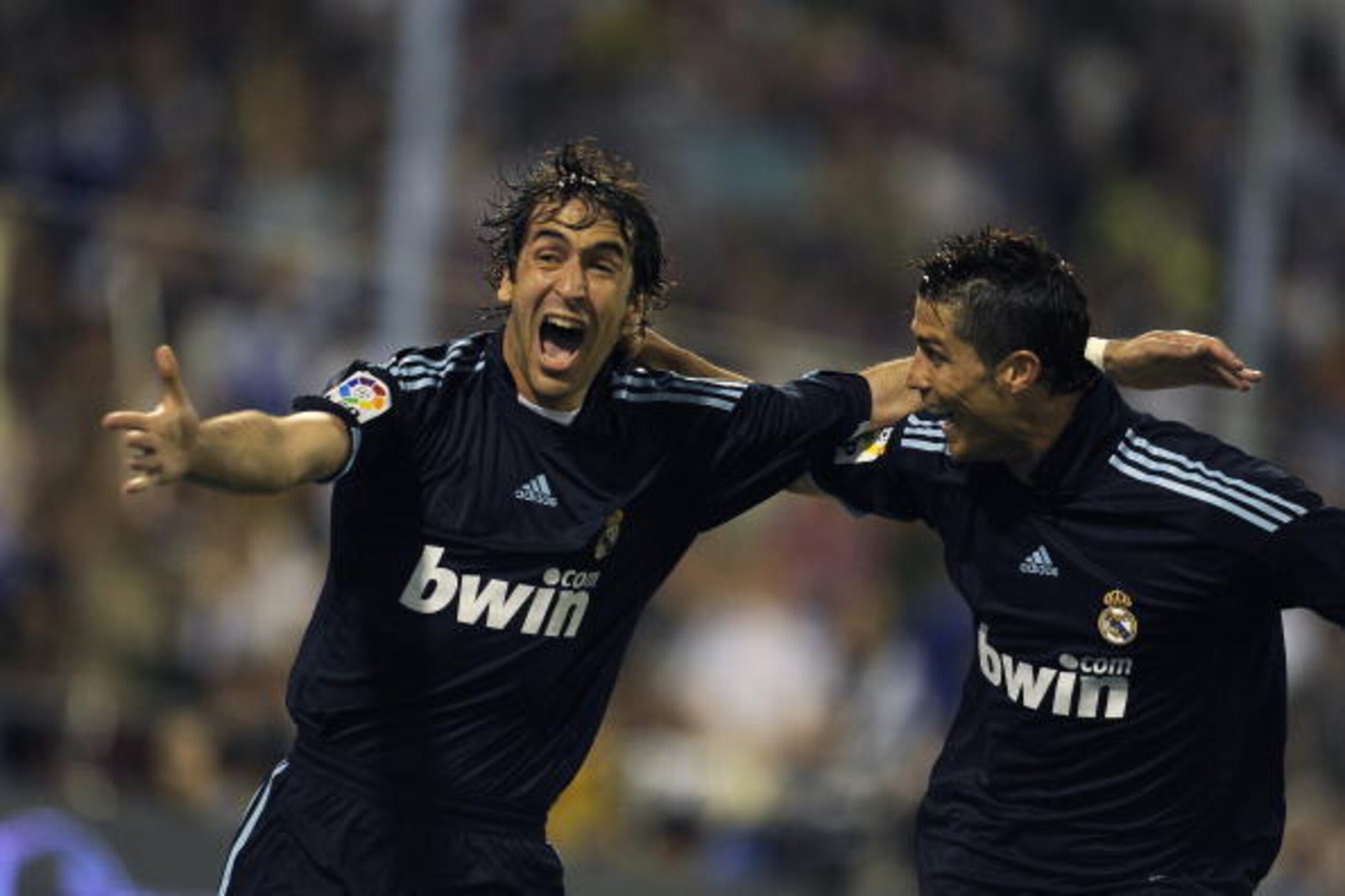 Real Madrid's Raul Gonzalez ( L ) celebrates his goal with teammate Portuguese forward Cristiano Ronaldo  against Zaragoza during their Spanish League football match at Romareda  stadium in Zaragoza  on April 24, 2010. AFP PHOTO / DANI POZO (Photo credit 