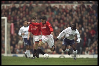 29 Mar 1996:  Ryan Giggs of Manchester United is pursued by Ruel Fox of Tottenham Hotspur during the Premiership clash at Old Trafford, wuich United won1-0.