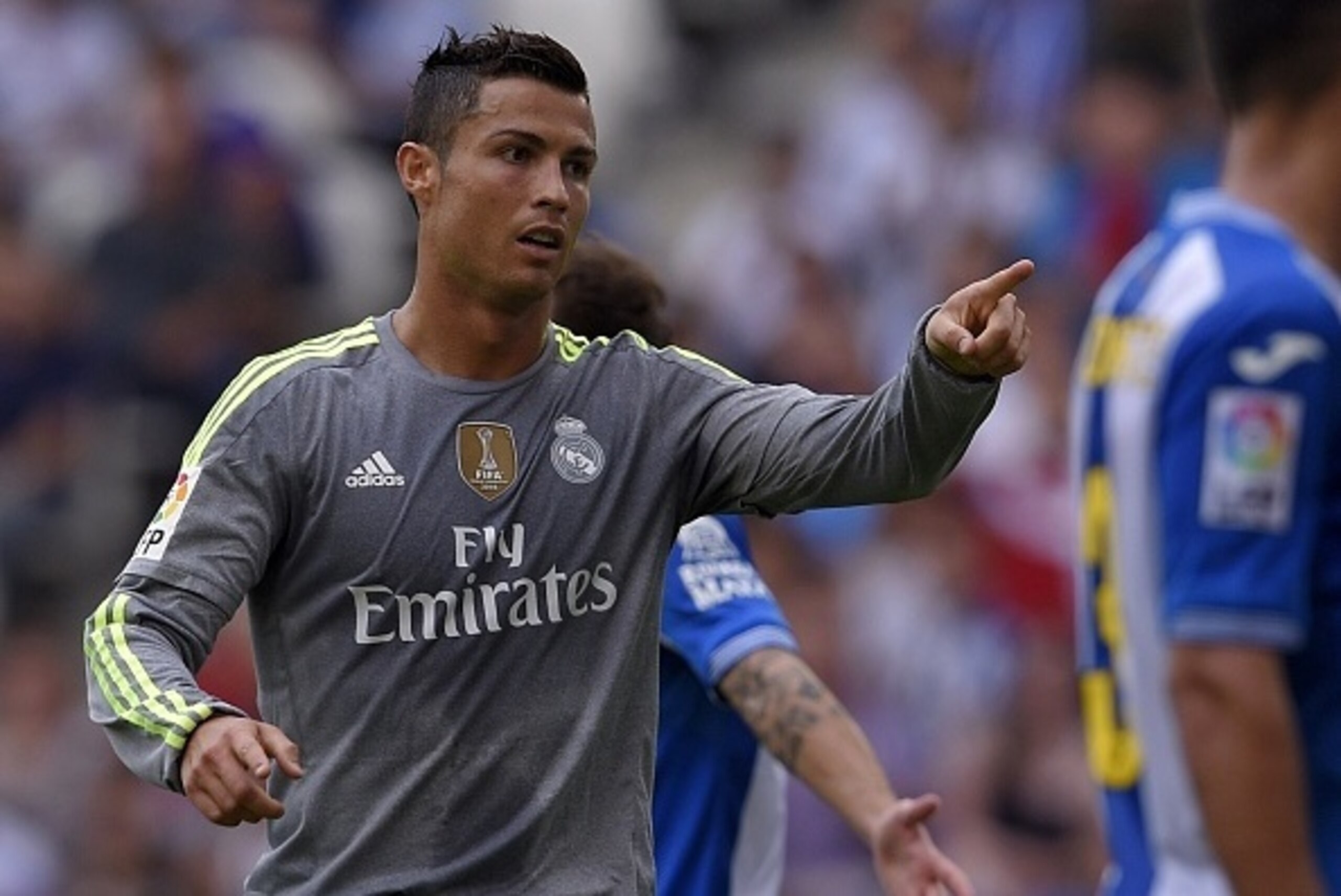 Real Madrid's Portuguese forward Cristiano Ronaldo reacts after scoring during the Spanish league football match RCD Espanyol vs Real Madrid CF at the Power8 stadium in Cornella de Llobregat on September 12, 2015. AFP PHOTO/ LLUIS GENE        (Photo credi