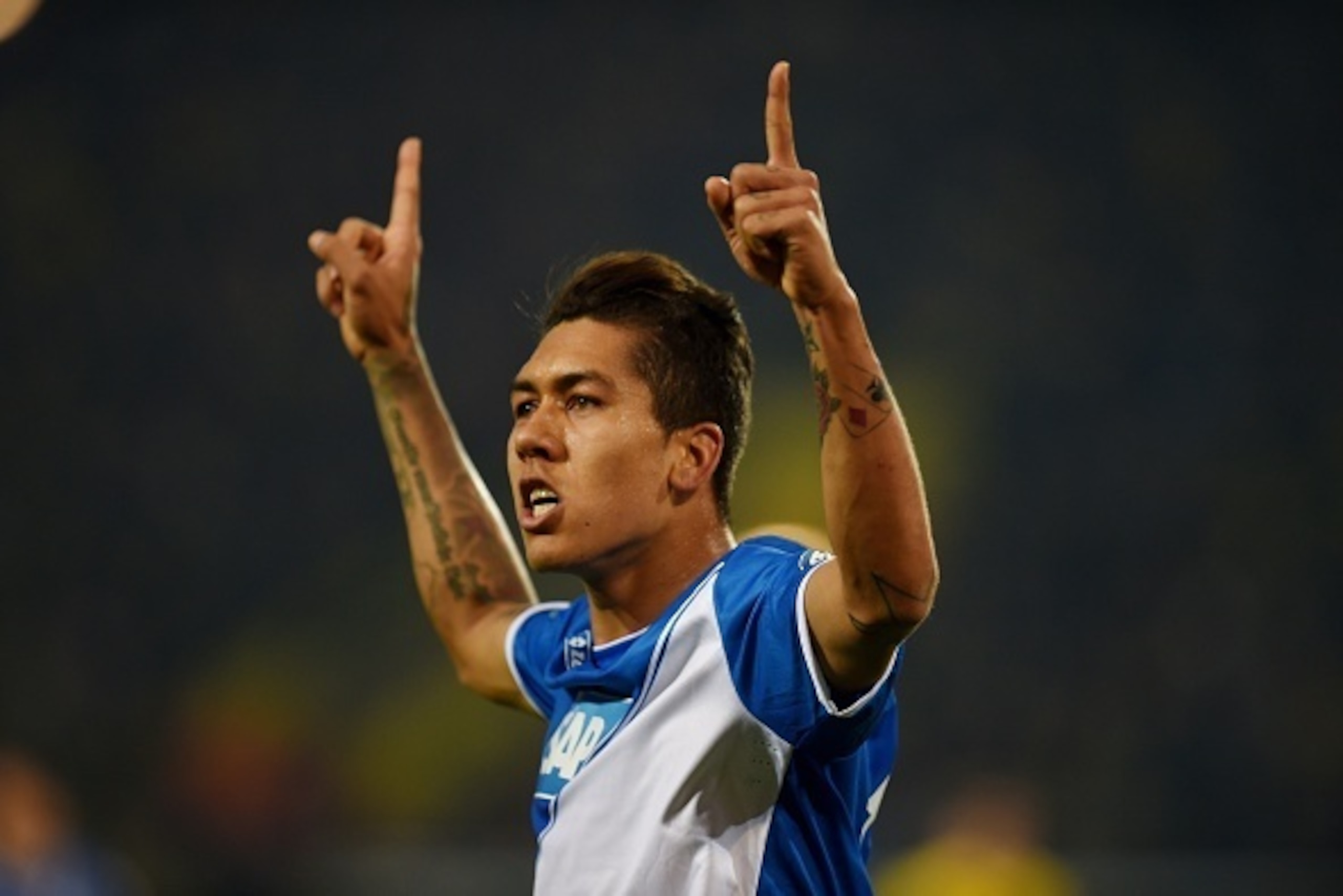 Hoffenheim's Brazilian midfielder Roberto Firmino celebrates during the German Football Cup DFB Pokal quarter-final match between Borussia Dortmund and 1899 Hoffenheim in Dortmund, western Germany, on April 7, 2015. AFP PHOTO / PATRIK STOLLARZ

DFB RULES 