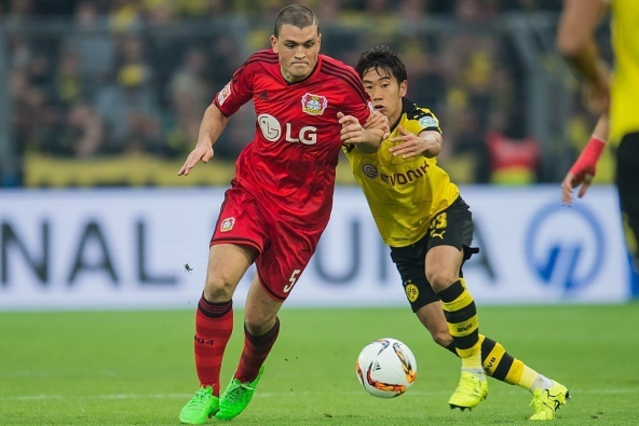 (L-R) Kyriakos Papadopoulos of Bayer 04 Leverkusen, Shinji Kagawa of Borussia Dortmund during the Bundesliga match between Borussia Dortmund and Bayer 04 Leverkusen on September 20, 2015 at the Signal Iduna Park in Dortmund, Germany.(Photo by VI Images vi