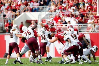 TUSCALOOSA, AL - SEPTEMBER 26:  Michael Johnson #34 of the Louisiana Monroe Warhawks pressures and forces Jake Coker #14 of the Alabama Crimson Tide to throw an interception at Bryant-Denny Stadium on September 26, 2015 in Tuscaloosa, Alabama.  (Photo by
