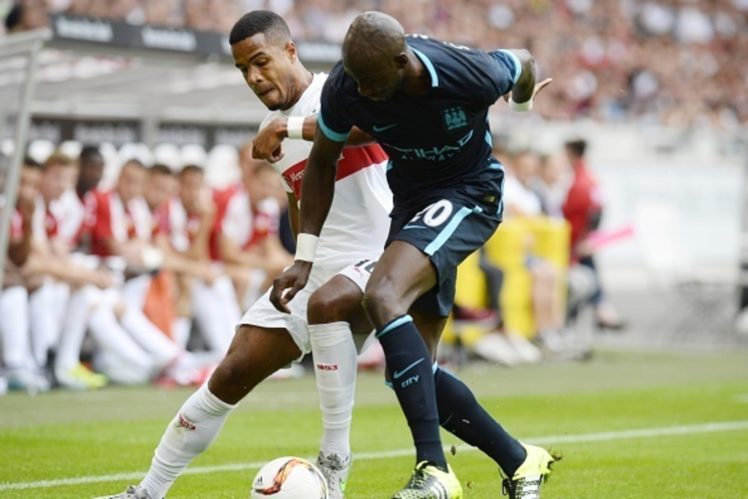 Stuttgart's midfielder Daniel Didavi (L) and Manchester's French defender Eliaquim Mangala vie for the ball during the friendly football match between VfB Stuttgart and Manchester City in Stuttgart, southern Germany, on August 1, 2015. AFP PHOTO / THOMAS 