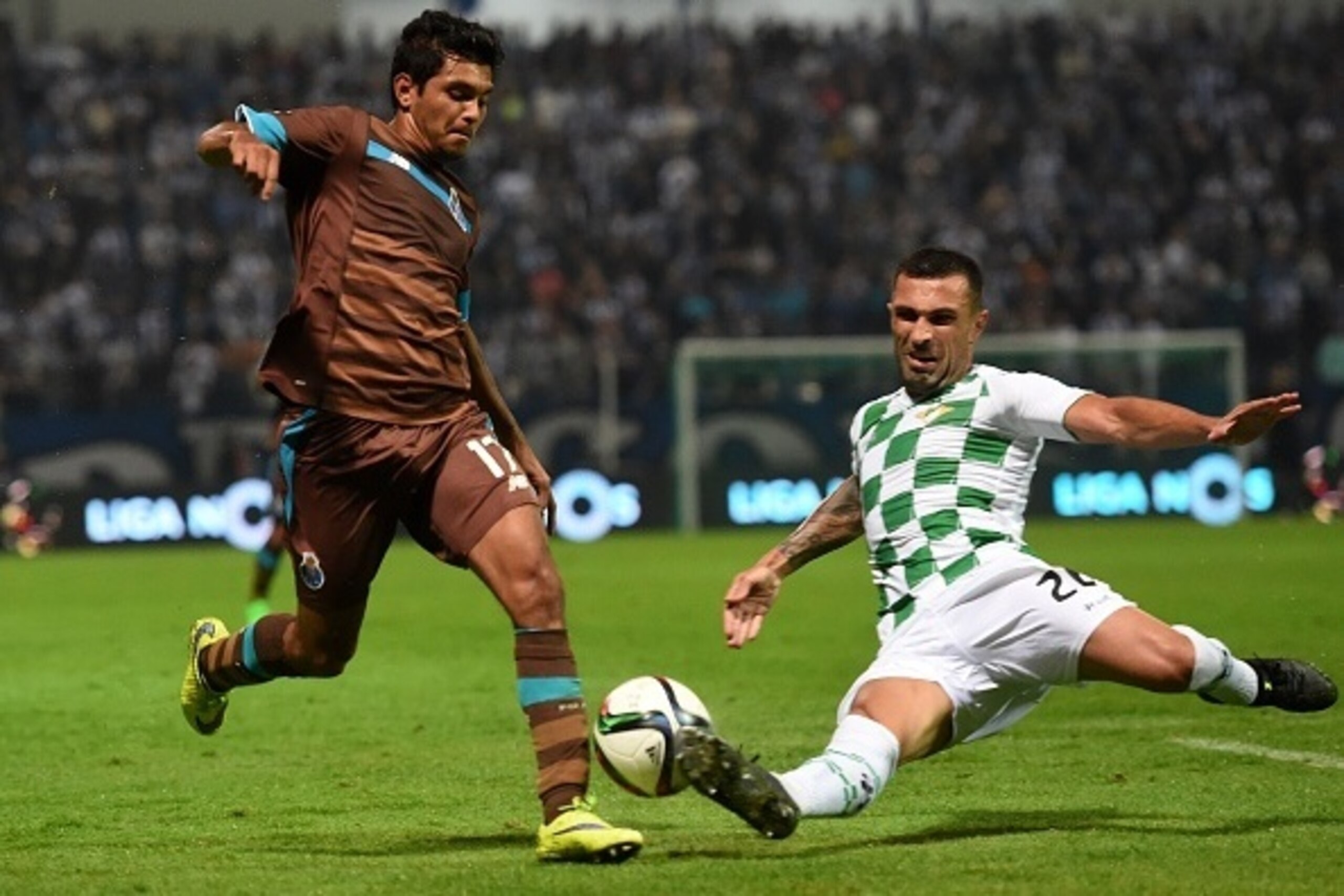 Porto's Mexican forward Jesus Corona (L) vies with Moreirense's Brazilian defender Marcelo Oliveira during the Portuguese league football match Moreirense FC vs FC Porto at the Comendador Joaquim de Almeida Freitas stadium in Moreira de Conegos on Spetemb