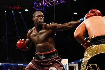 Jun 13, 2015; Birmingham, AL, USA;  Deontay Wilder hits Eric Molina during the WBC Championship at Bartow Arena. Mandatory Credit: Marvin Gentry-USA TODAY Sports
