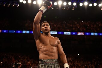 LONDON, ENGLAND - SEPTEMBER 12:  Anthony Joshua acknowledges the crowd after defeating Gary Cornish for the WBC International Heavyweight title & vacant Commonwealth Heavyweight title during 'Heavy Duty' fight night at The O2 Arena on September 12, 2015 i