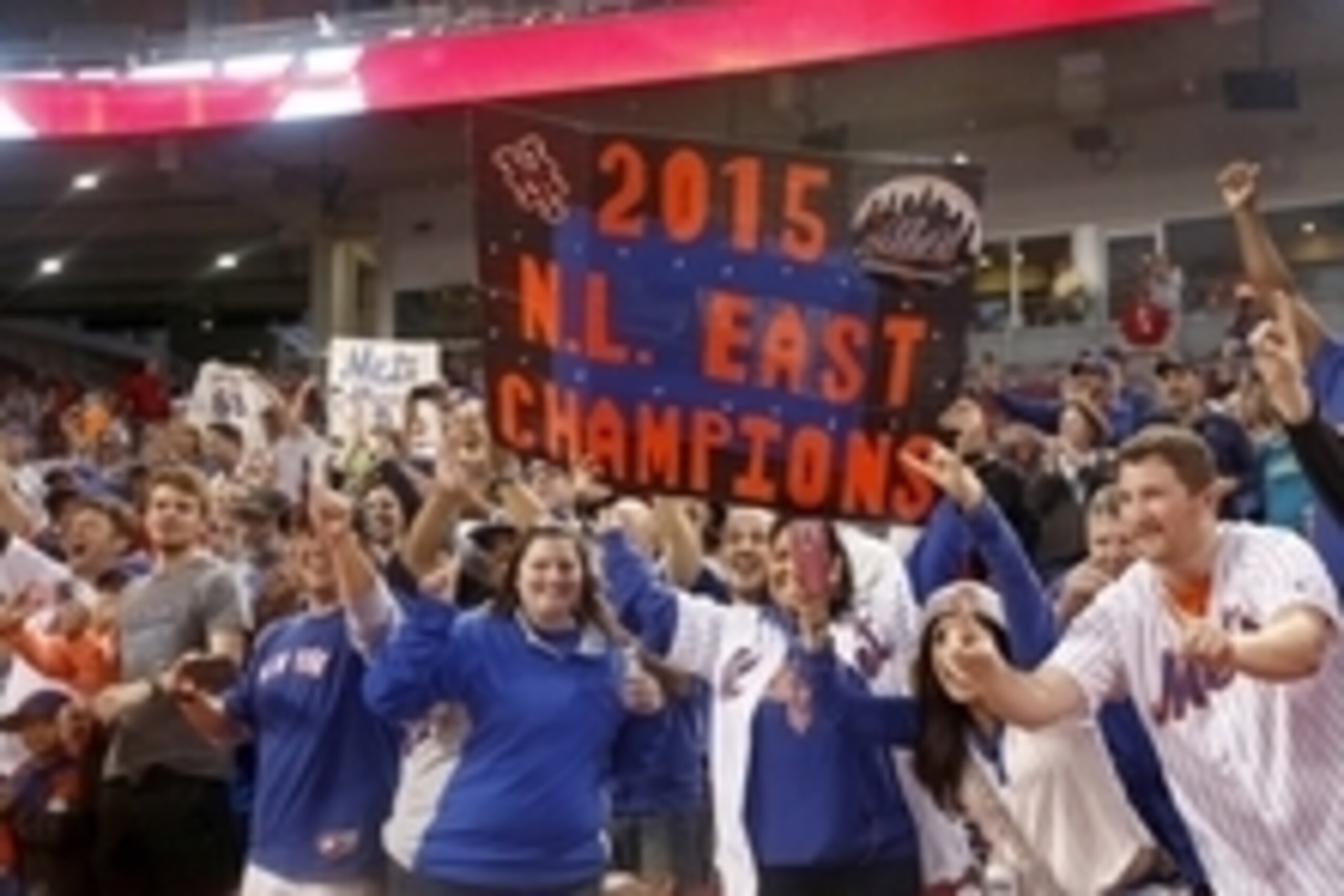 Sep 26, 2015; Cincinnati, OH, USA; Fans celebrate in the stands after the New York Mets clinched the National League East Championship at Great American Ball Park. The Mets beat the Cincinnati Reds 10-2. Mandatory Credit: David Kohl-USA TODAY Sports