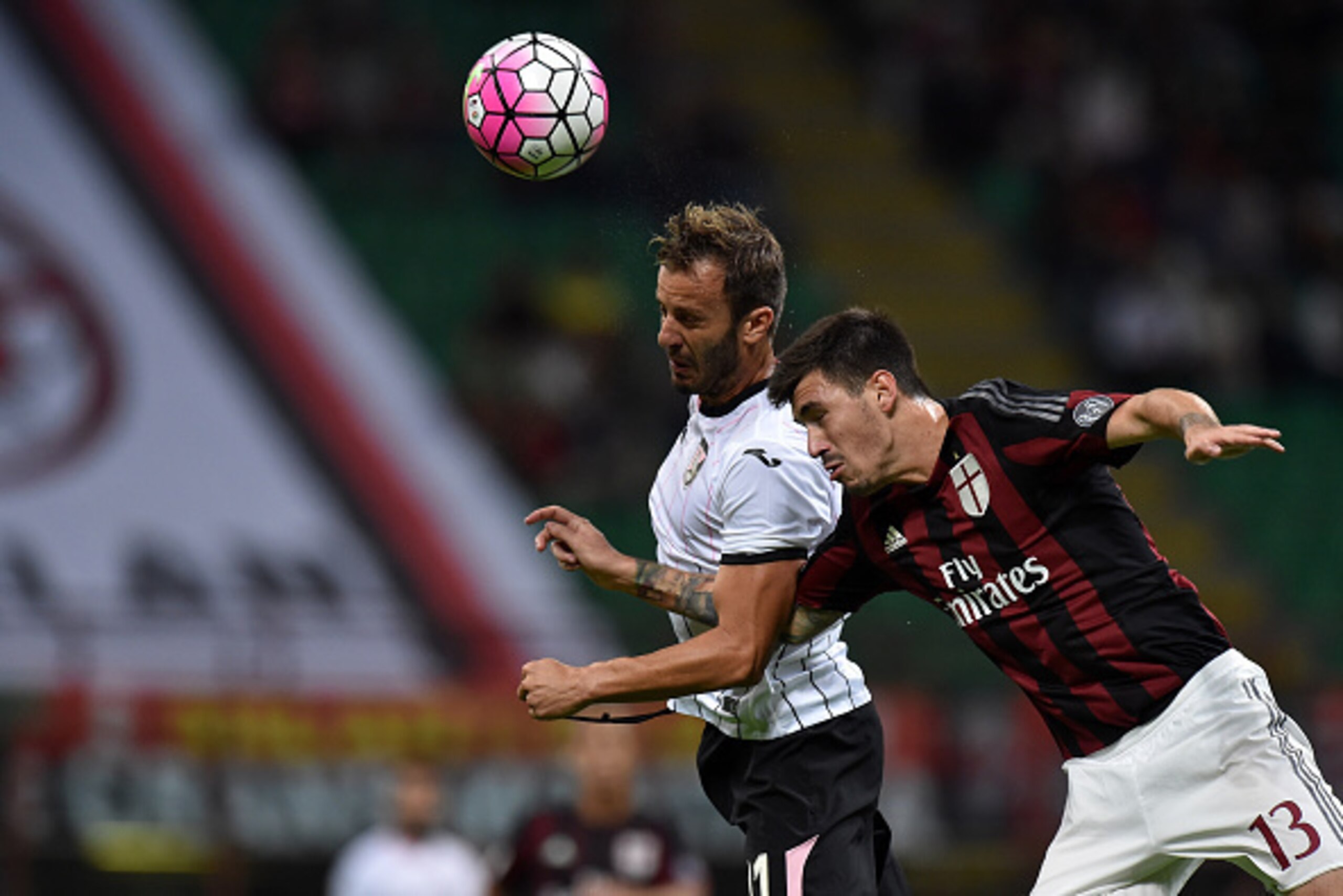 MILAN, ITALY - SEPTEMBER 19:  Alberto Gilardino (L) of Palermo and Alessio Romagnoli of Milan compete for the ball during the Serie A match between AC Milan and US Citta di Palermo at Stadio Giuseppe Meazza on September 19, 2015 in Milan, Italy.  (Photo b