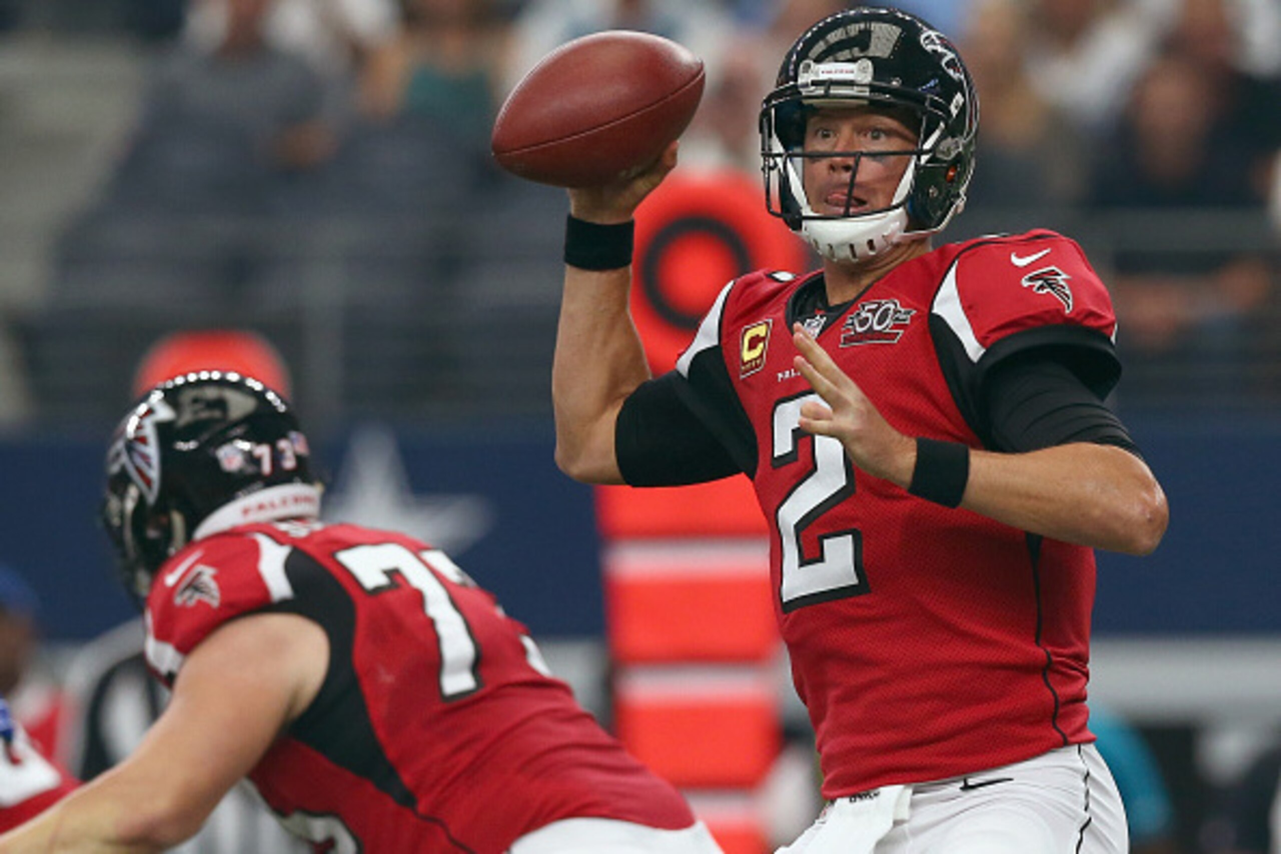 ARLINGTON, TX - SEPTEMBER 27:   Matt Ryan #2 of the Atlanta Falcons looks for an open receiver against the Dallas Cowboys at AT&T Stadium on September 27, 2015 in Arlington, Texas.  (Photo by Tom Pennington/Getty Images)