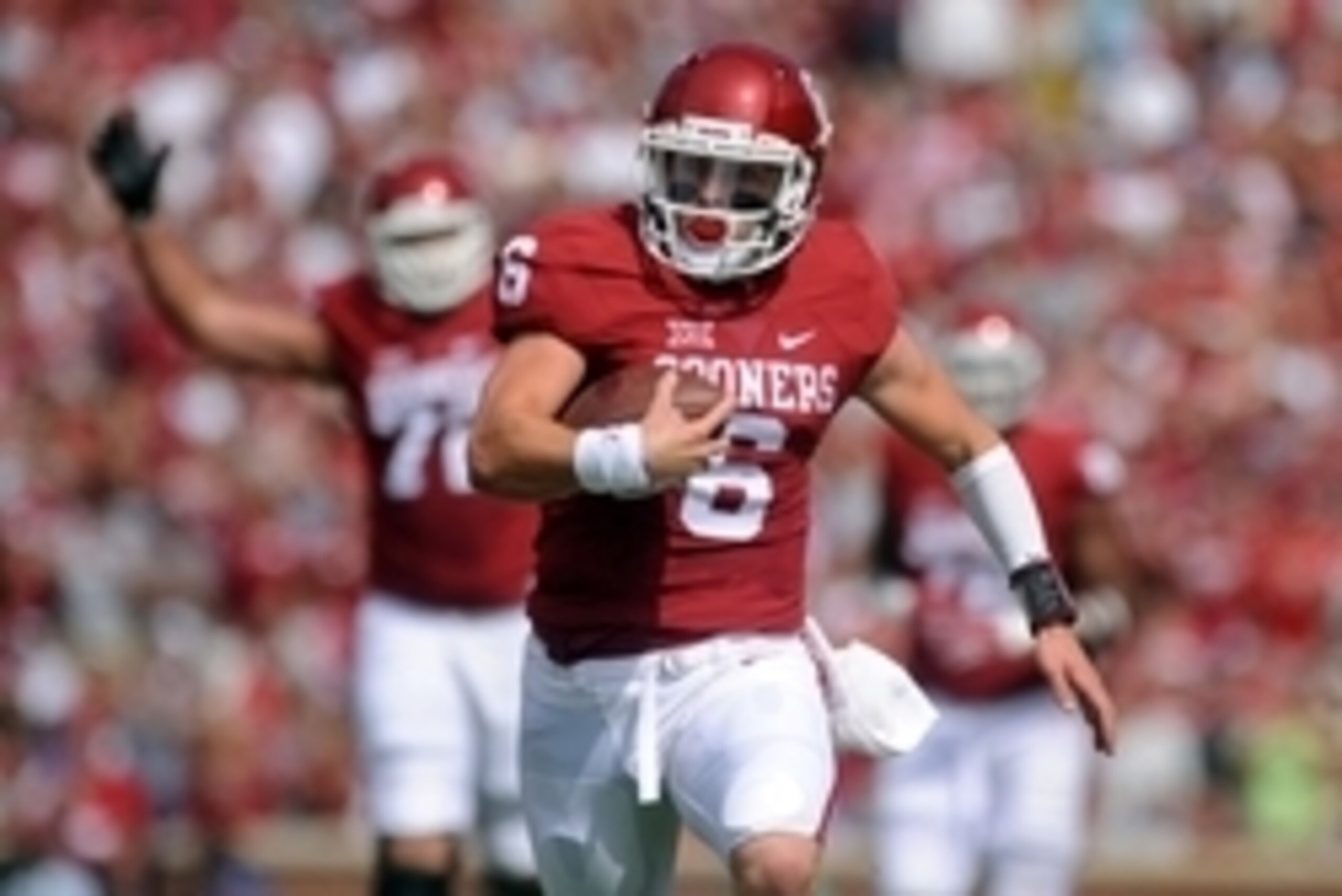 Sep 19, 2015; Norman, OK, USA; Oklahoma Sooners quarterback Baker Mayfield (6) runs for a touchdown against the Tulsa Golden Hurricane during the first quarter at Gaylord Family - Oklahoma Memorial Stadium. Mandatory Credit: Mark D. Smith-USA TODAY Sports