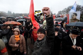 A man raises his fist as activists of various Russian nationalist movements take part in a rally during the National Unity Day in Saint Petersburg on November 4, 2013.  About 10,000 Russian ultra-nationalists marched across Moscow on Monday in an annual s