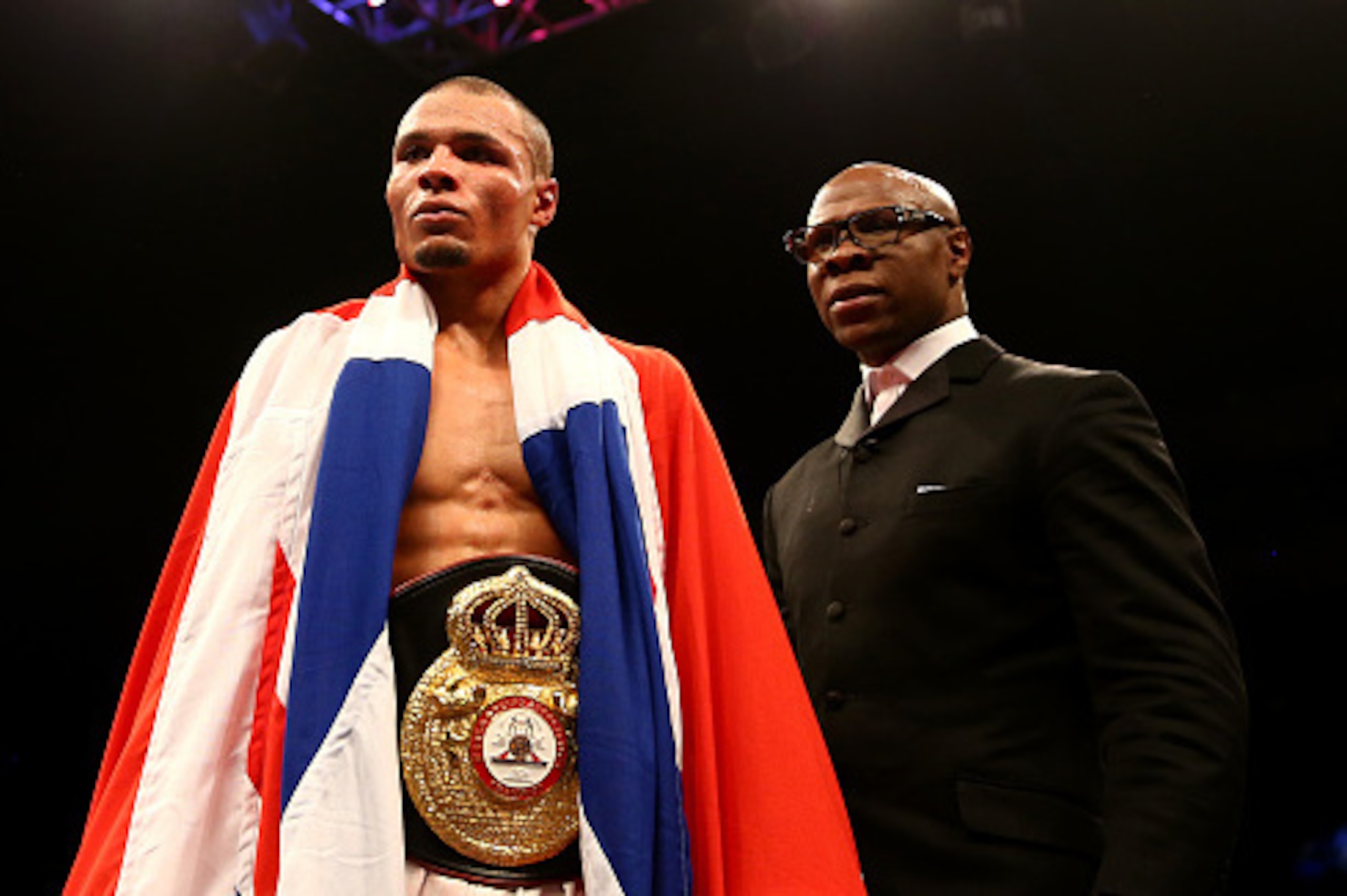 LONDON, ENGLAND - FEBRUARY 28:  Chris Eubank Jnr is watched by his father Chris Eubank as he celebrates victory over Dmitry Chudinov for the WBA Interim World Middleweight Championship at the O2 Arena on February 28, 2015 in London, England.  (Photo by Ri