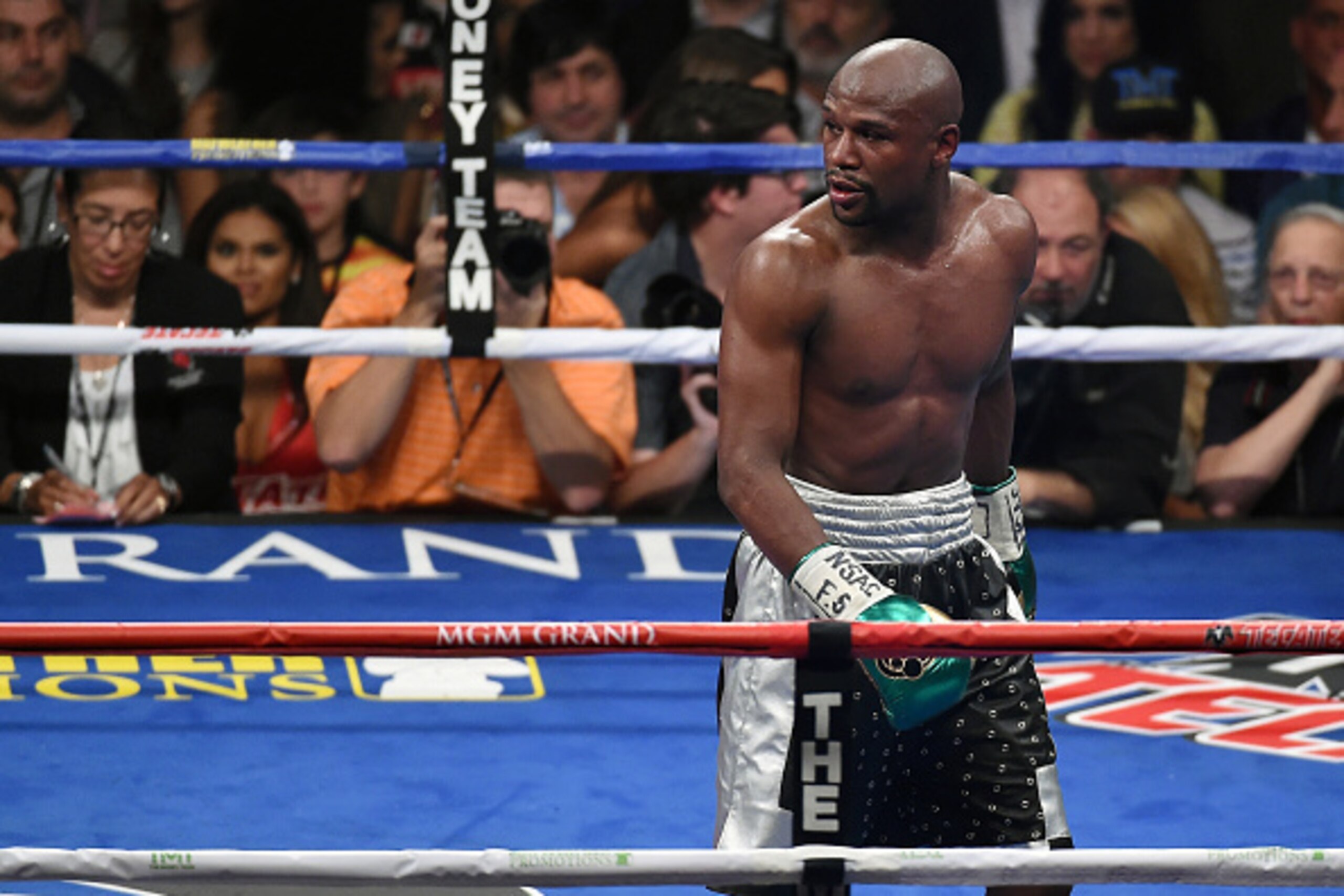LAS VEGAS, NV - SEPTEMBER 12:  Floyd Mayweather Jr. looks back at Andre Berto's corner after the sixth round of their WBC/WBA welterweight title fight at MGM Grand Garden Arena on September 12, 2015 in Las Vegas, Nevada. Mayweather retained his titles wit