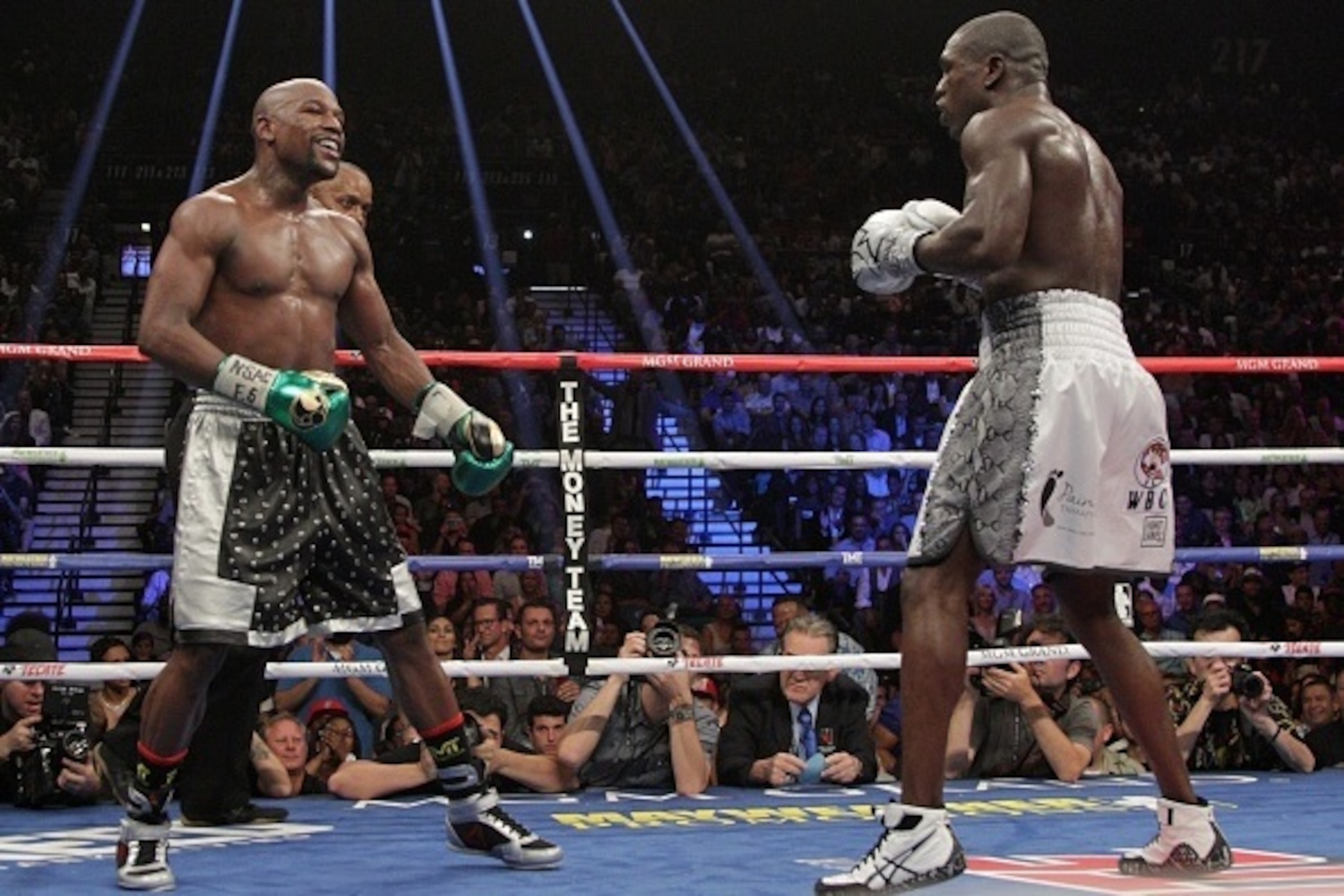 Floyd Mayweather Jr. (L) and Andre Berto fight for the WBO Welterweight World Title at the MGM Grand Garden Arena in Las Vegas, Nevada on September 12, 2015.  Floyd Mayweather earned a unanimous decision over Andre Berto on Saturday to claim his 49th and 