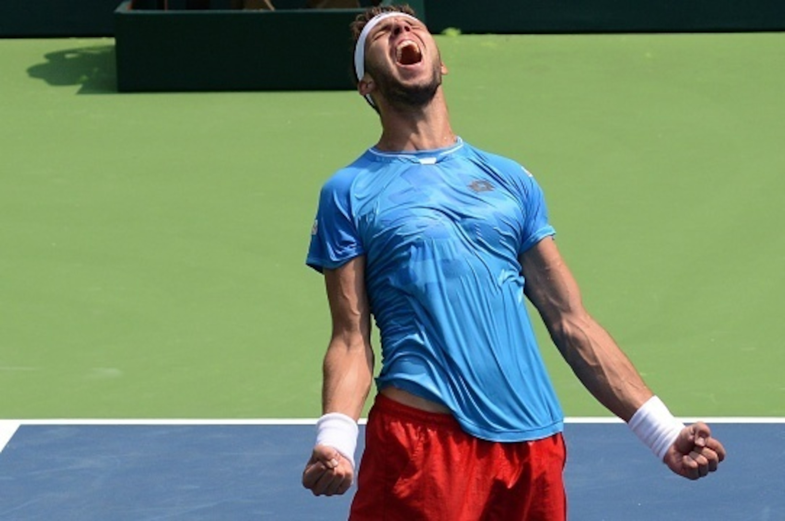 Czech Republic's Jiri Vesely celebrates victory over India's Yuki Bhambri in the men's singles match on the third day of the Davis Cup play-offs at The R.K.Khanna Tennis Stadium in New Delhi on September 20, 2015. AFP PHOTO / MONEY SHARMA        (Photo cr