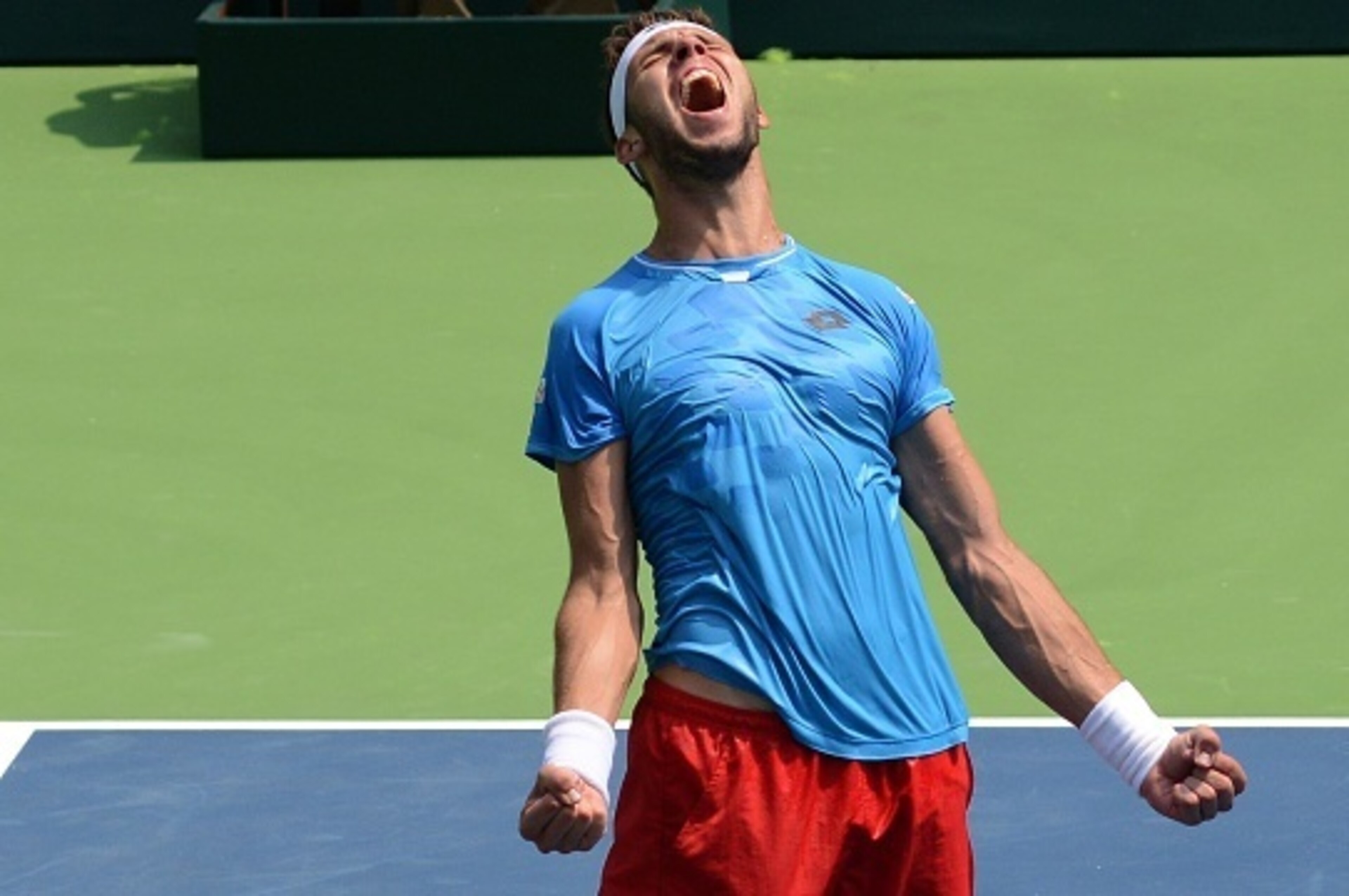 Czech Republic's Jiri Vesely celebrates victory over India's Yuki Bhambri in the men's singles match on the third day of the Davis Cup play-offs at The R.K.Khanna Tennis Stadium in New Delhi on September 20, 2015. AFP PHOTO / MONEY SHARMA        (Photo cr