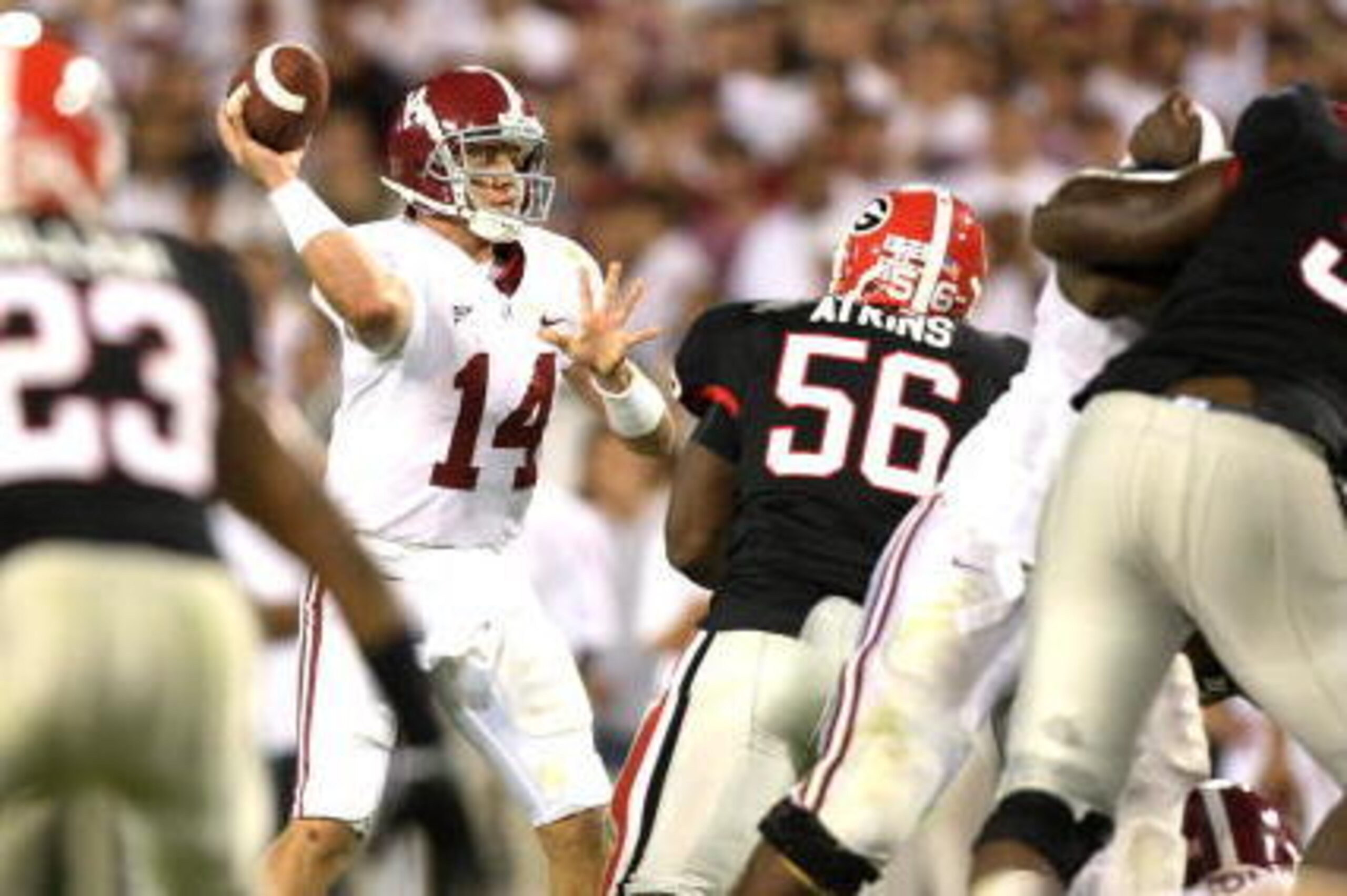 ATHENS, GA - SEPTEMBER 27:  Quarterback John Parker Wilson #14 of the Alabama Crimson Tide throws a pass against the Georgia Bulldogs at Sanford Stadium on September 27, 2008 in Athens, Georgia. Alabama defeated Georgia 41-30.  (Photo by Doug Benc/Getty I