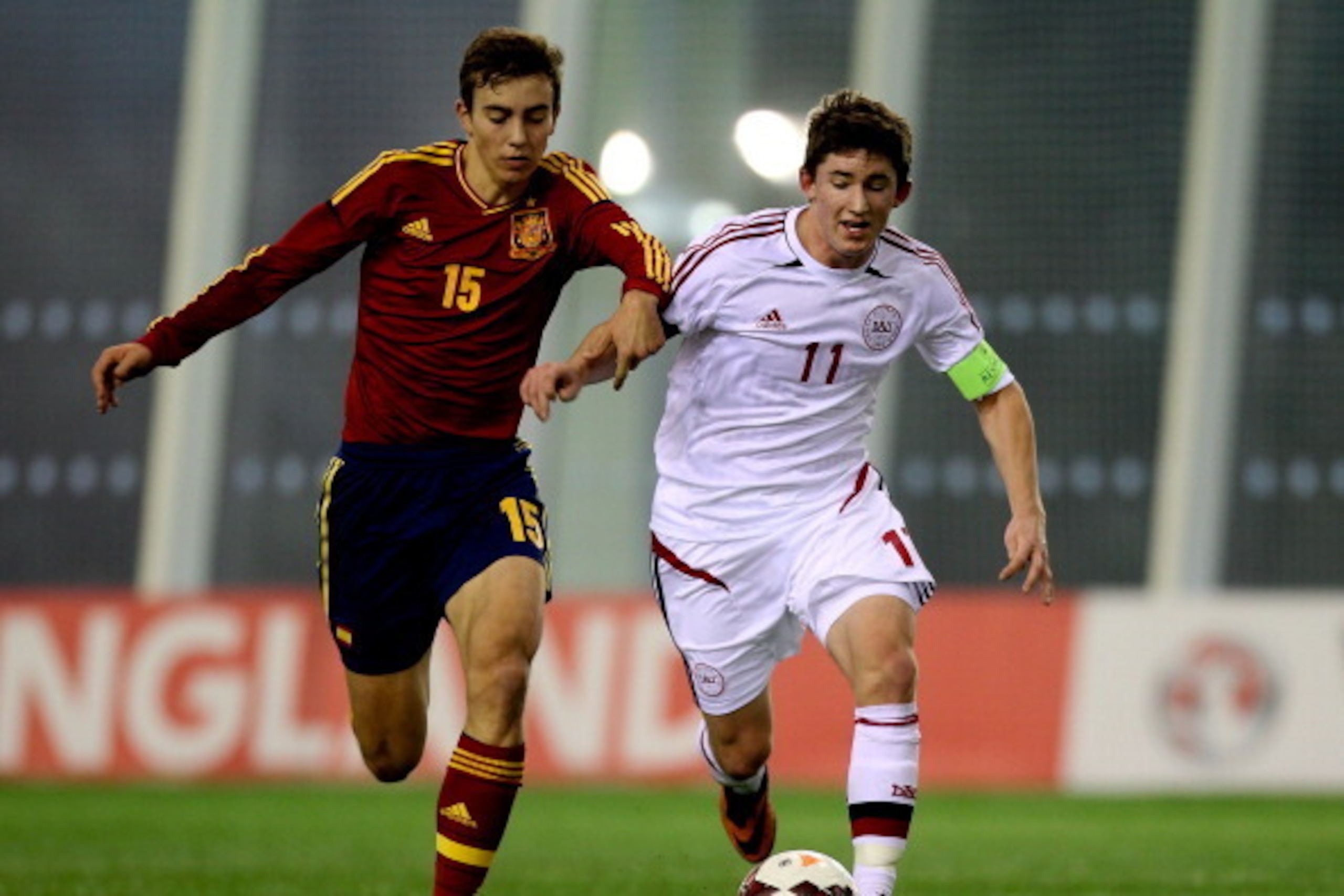 BURTON-UPON-TRENT, ENGLAND - FEBRUARY 14: Mark Brink Christensen of Denmark holds off pressure from Oriol Busquets of Spain during a U16 Internation match between Spain and Denmark at St Georges Park on February 14, 2014 in Burton-upon-Trent, England.  (P