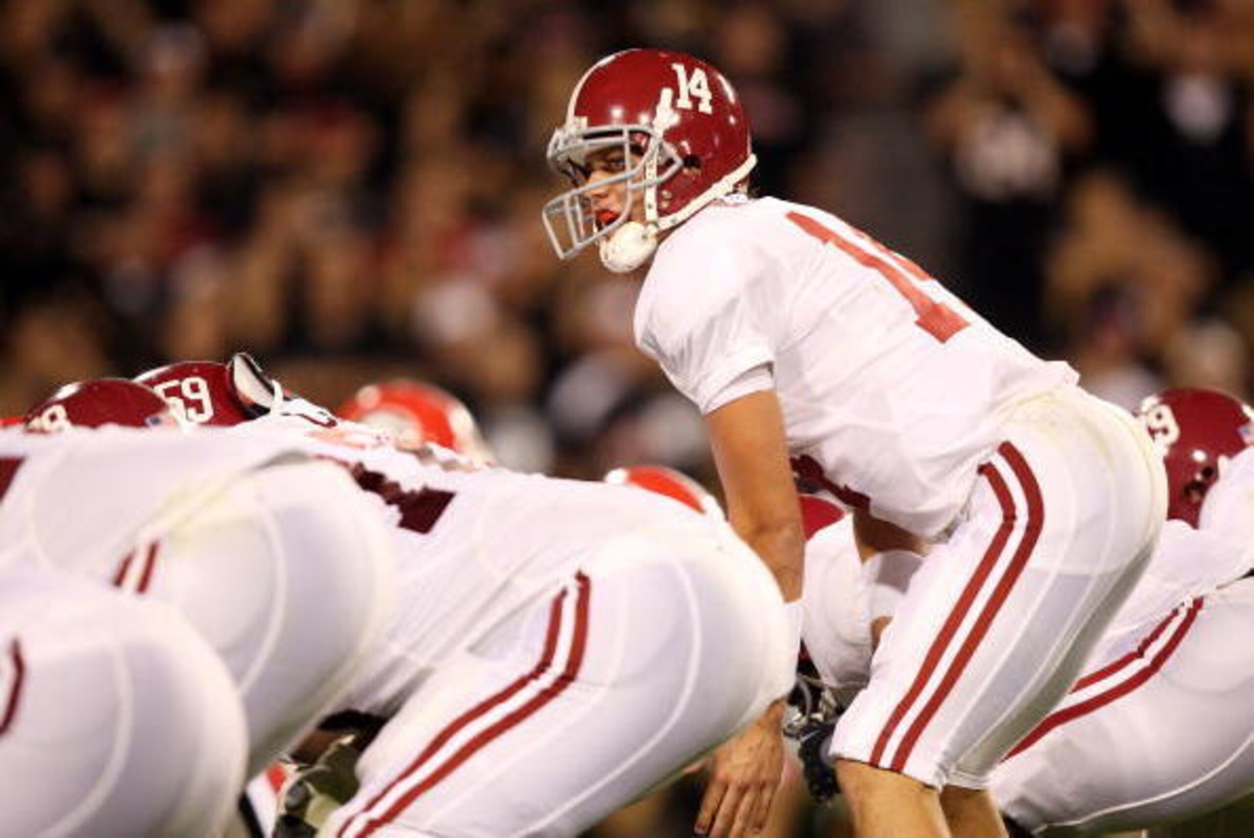 ATHENS, GA - SEPTEMBER 27:  Quarterback John Parker Wilson #14 of the Alabama Crimson Tide calls a play at the line of scimmage against the Georgia Bulldogs at Sanford Stadium on September 27, 2008 in Athens, Georgia. Alabama defeated Georgia 41-30.  (Pho