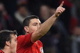 Greek defender Kyriakos Papadopolous (R) celebrates scoring during the first leg UEFA Champions League Group C football match Bayer 04 Leverkusen vs FC Zenit St Petersburg, in Leverkusen, western Germany on October 22, 2014. AFP PHOTO / PATRIK STOLLARZ   