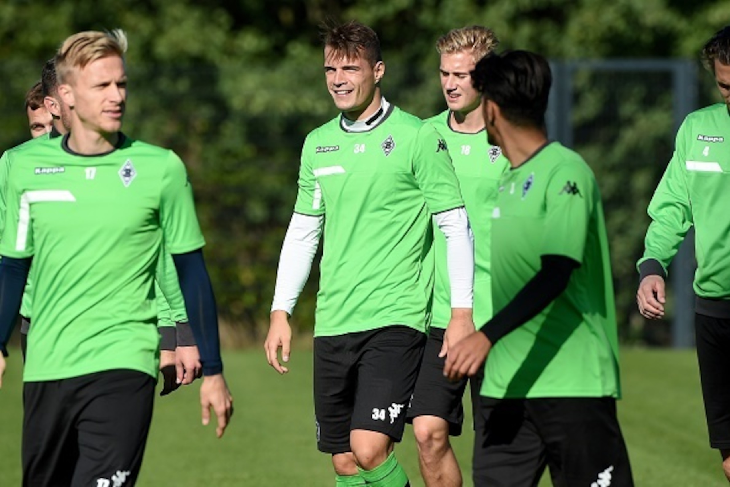 Moenchengladbach's Swiss midfielder Granit Xhaka (C) walks with teammates during a training session on the eve of the Group D, first-leg UEFA Champions League football match Borussia Moenchengladbach vs Manchester City FC in Moenchengladbach, western Germ Moenchengladbach's Swiss midfielder Granit Xhaka (C) walks with teammates during a training session on the eve of the Group D, first-leg UEFA Champions League football match Borussia Moenchengladbach vs Manchester City FC in Moenchengladbach, western Germ