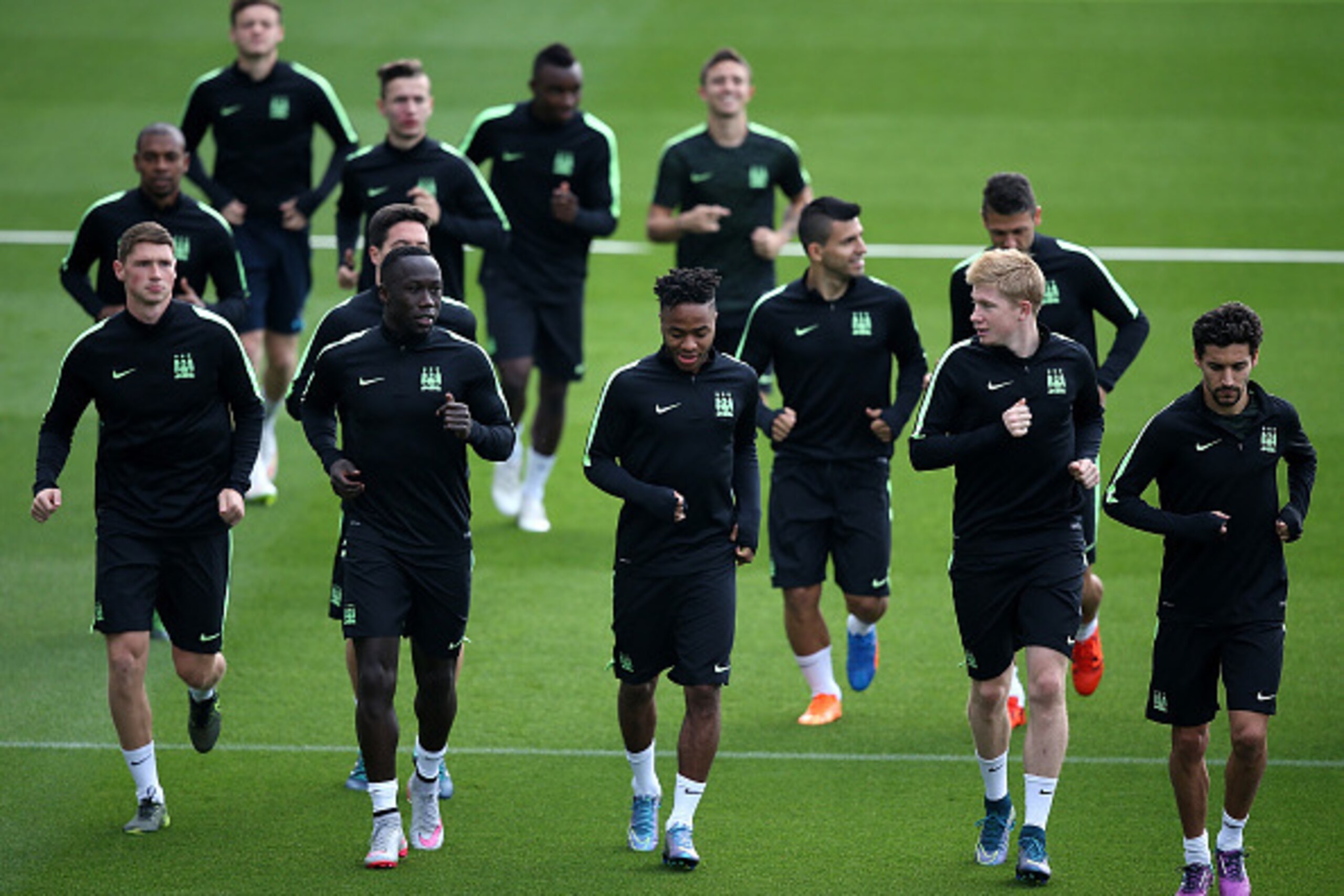 MANCHESTER, ENGLAND - SEPTEMBER 29: Raheem Sterling(C) chats with Kevin De Bruyne(R) and Bacary Sagna(L) during a Manchester City training session ahead of their Champions League fixture against Borussia Moenchengladbach at City Football Academy on Septe MANCHESTER, ENGLAND - SEPTEMBER 29: Raheem Sterling(C) chats with Kevin De Bruyne(R) and Bacary Sagna(L) during a Manchester City training session ahead of their Champions League fixture against Borussia Moenchengladbach at City Football Academy on Septe