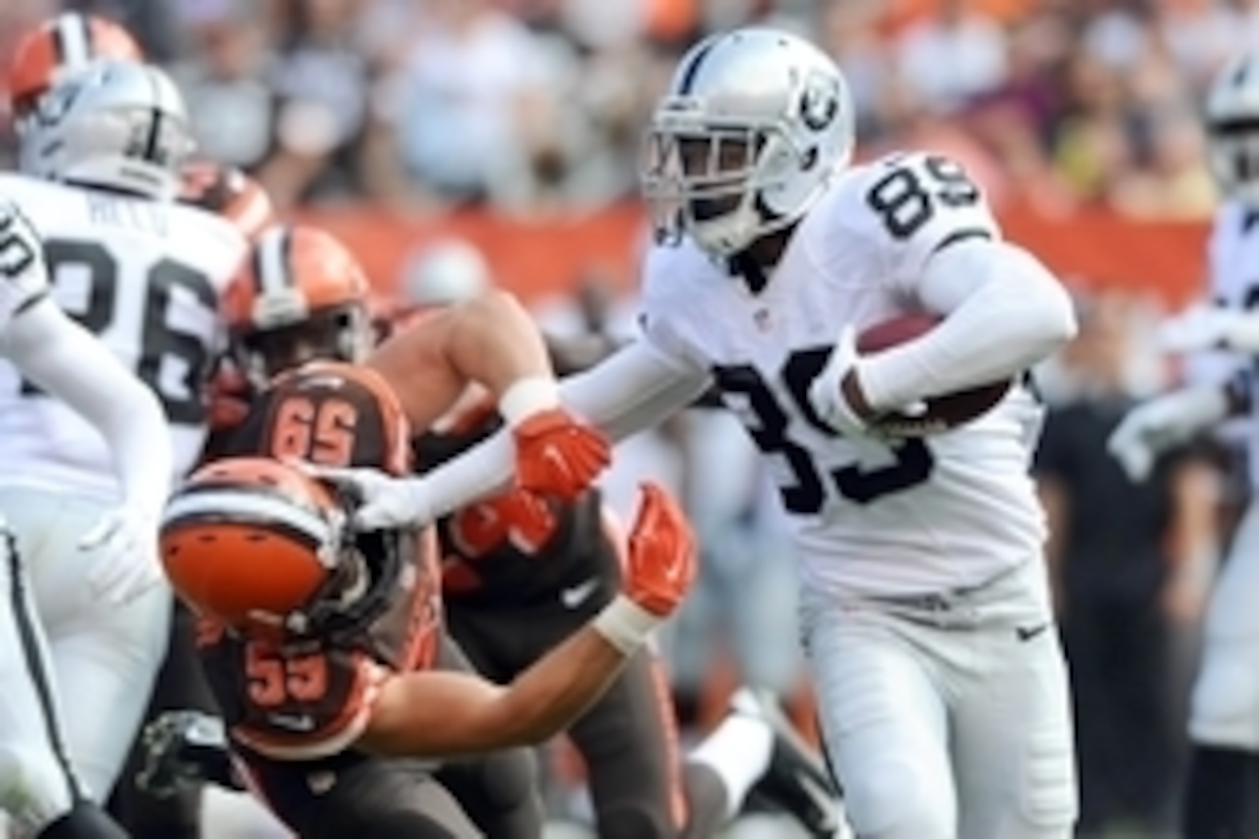 Sep 27, 2015; Cleveland, OH, USA; Oakland Raiders wide receiver Amari Cooper (89) stiff arms Cleveland Browns inside linebacker Tank Carder (59) during the second half at FirstEnergy Stadium.  The Raiders won 27-20. Mandatory Credit: Ken Blaze-USA TODAY S